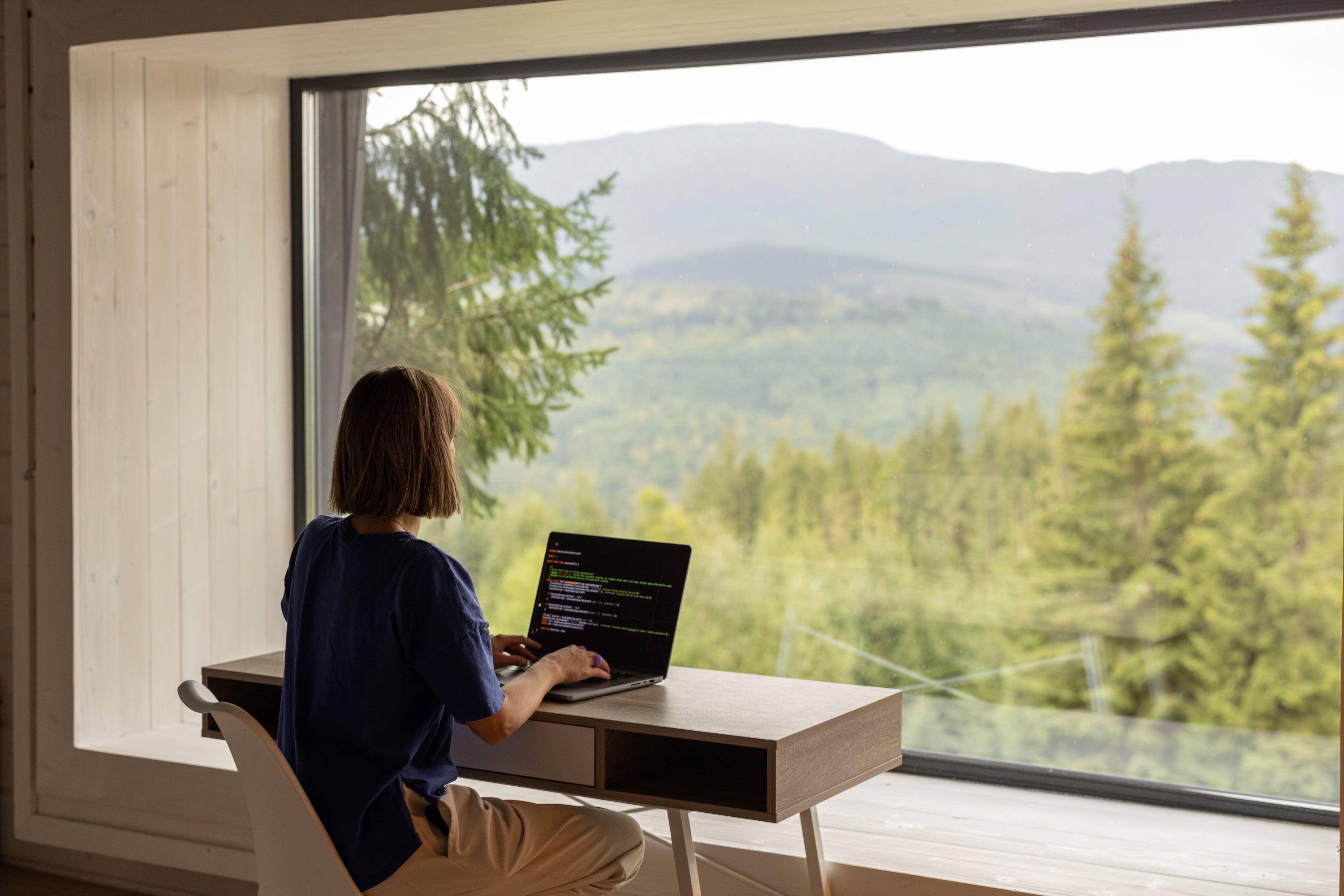 Positioning your workspace near a window can help reduce reliance on artificial lighting throughout the day, says Kirkman