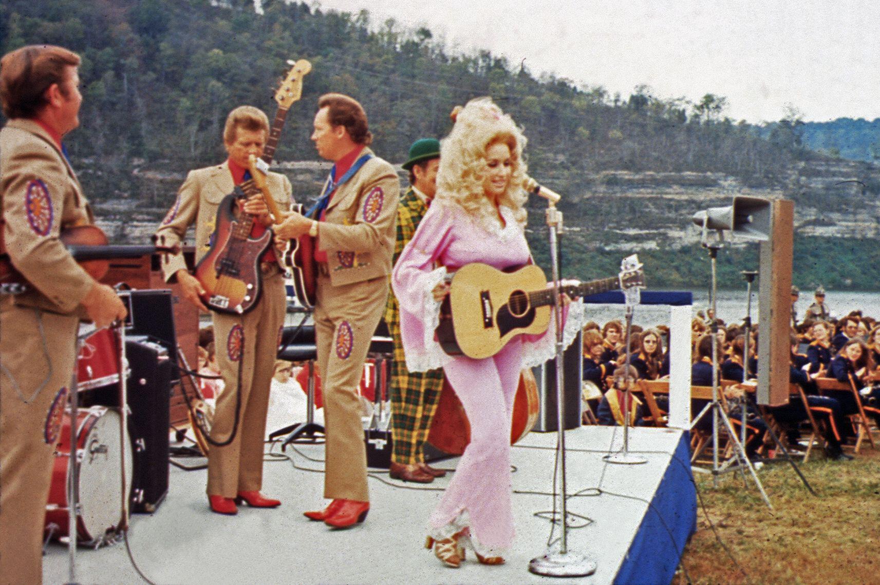 Parton looked every inch the Seventies star in a pale pink trouser suit with flared legs and bell sleeves (Alamy/PA)