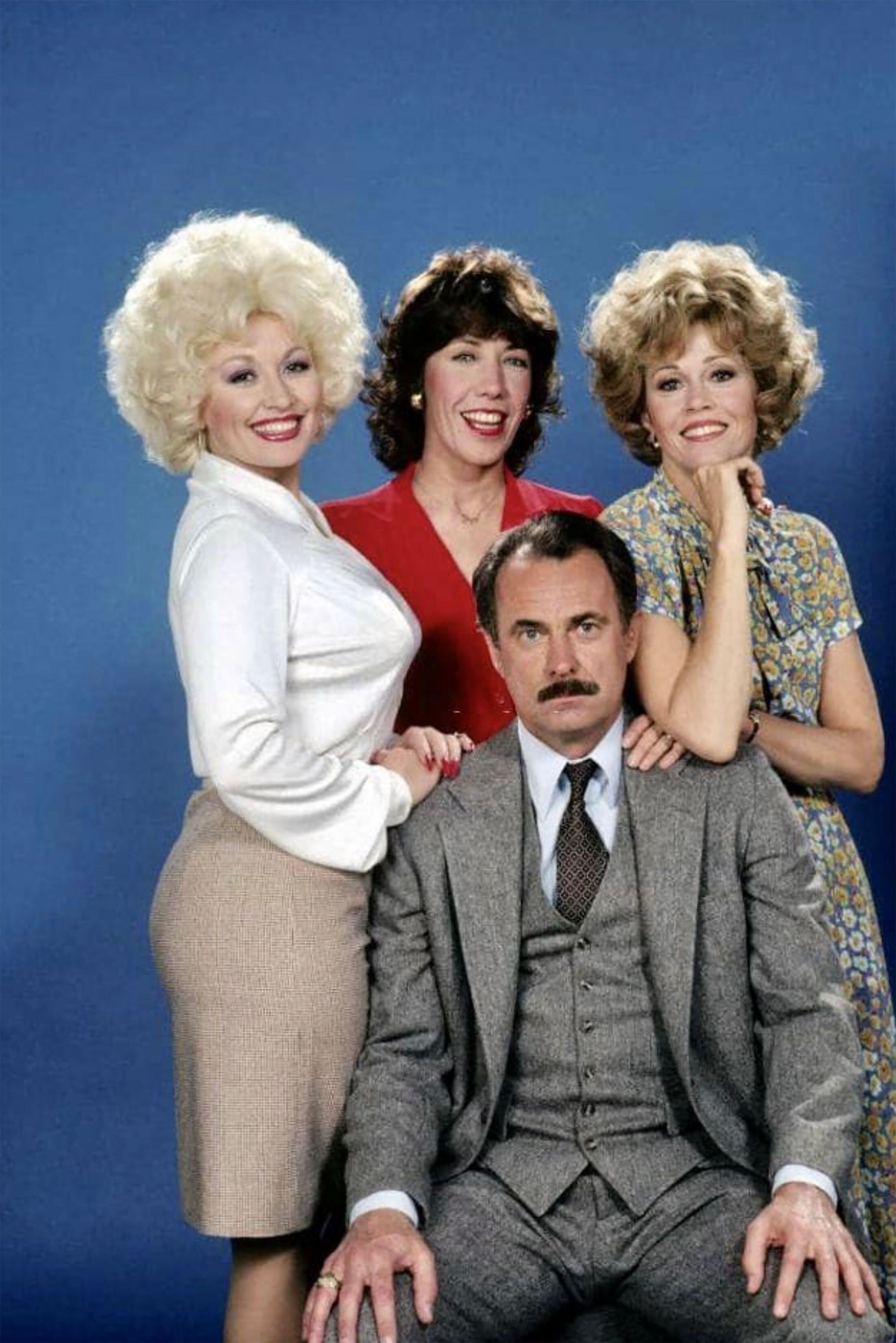 Sporting a blouse and pencil skirt for the promotional pictures, the outfit’s construction is still very Dolly (Alamy/PA)