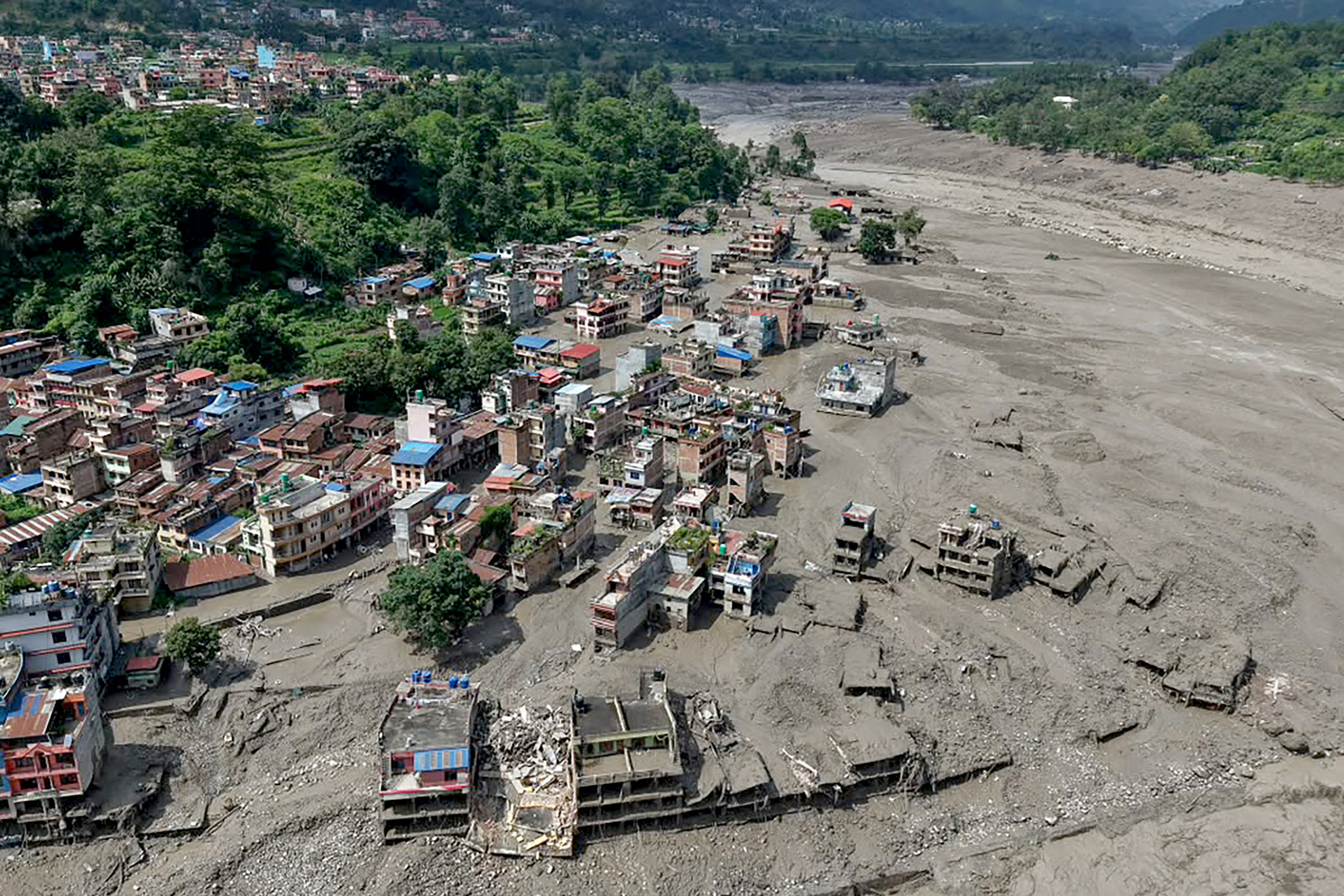What caused the devastating Nepal flash floods on the Tibet border?