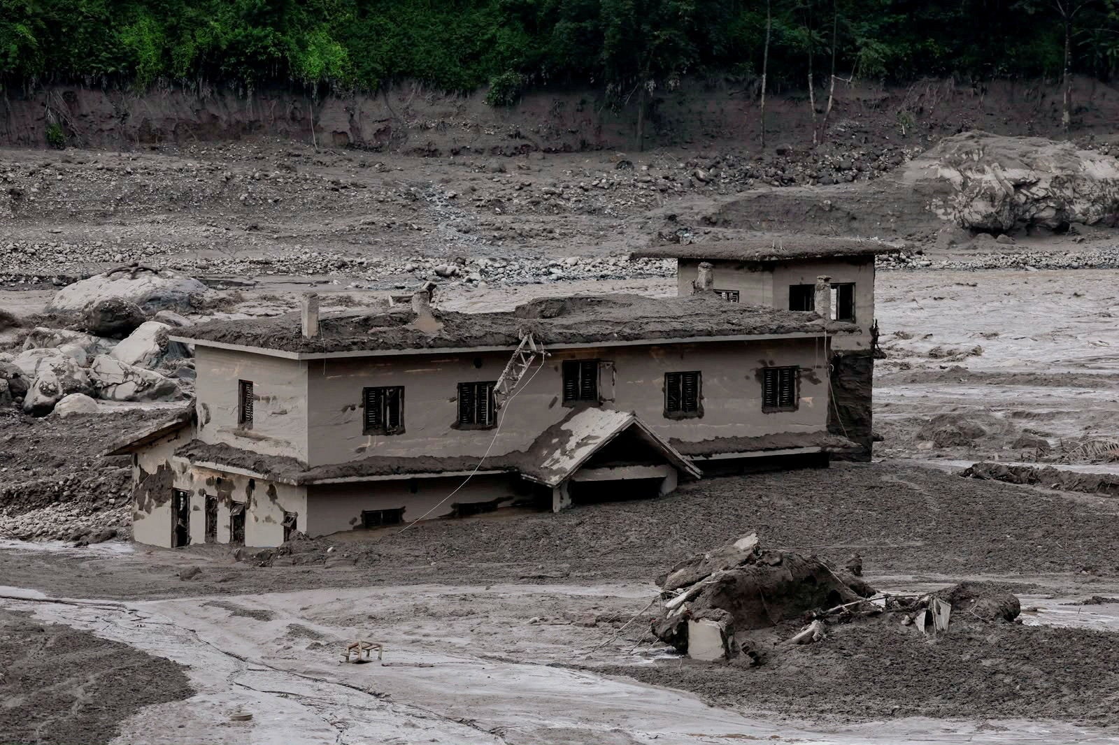 Mud covers a property following a flash flood at Trishuli in Nuwakot district, Nepal.