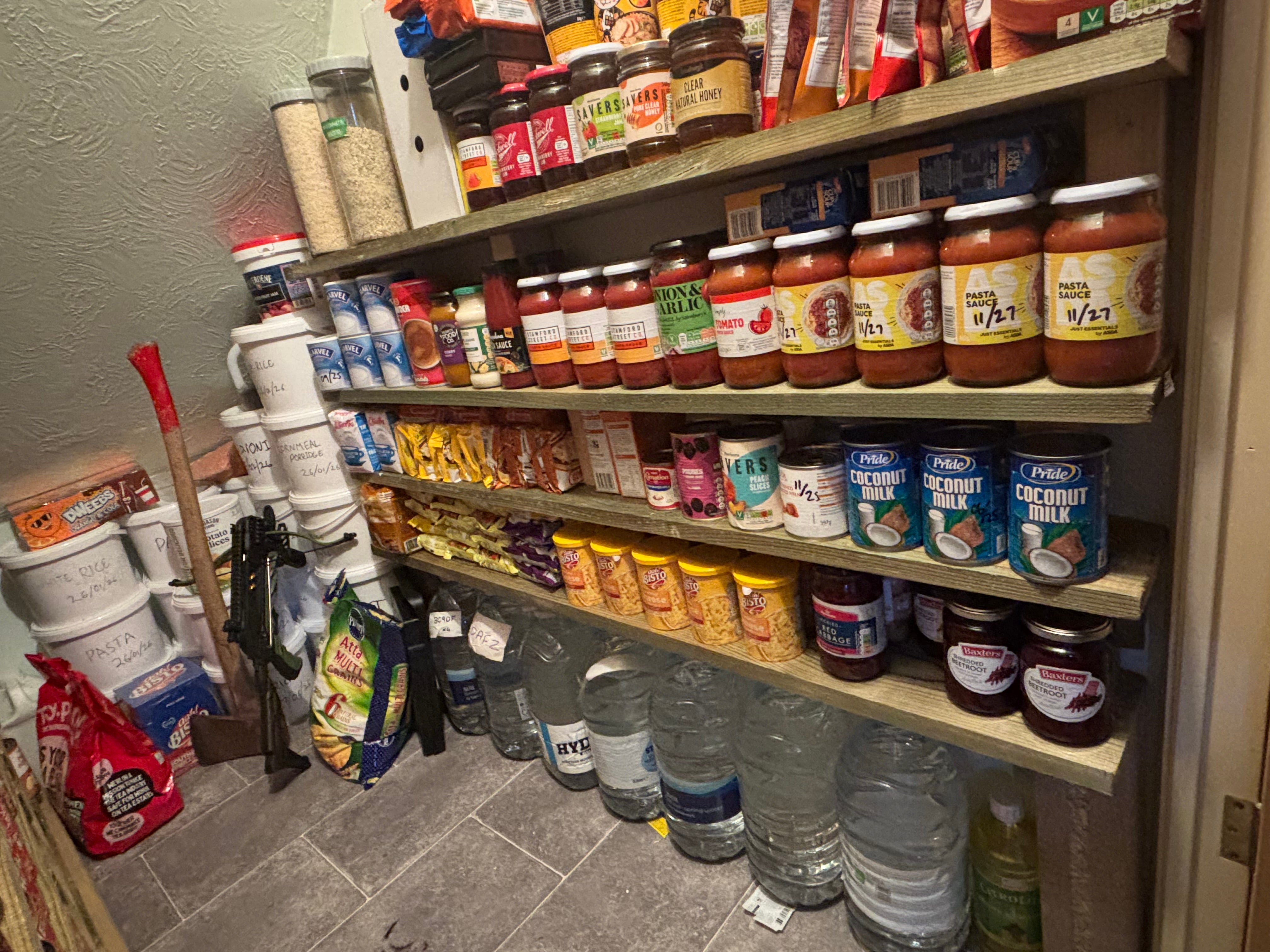 Mike's pantry includes bottled jars and tins of food which he labels with use-by-dates as part of a regular six-monthly audit