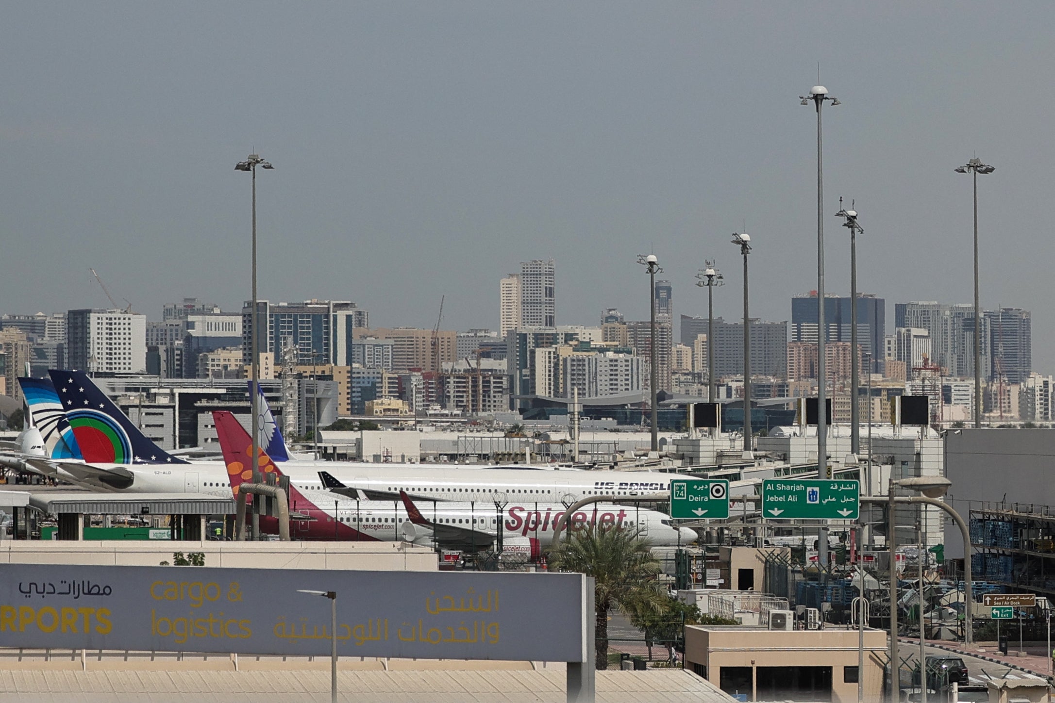 Planes parked at Dubai International Airport on March 11, 2026 after drones fell near the airport, injuring four people