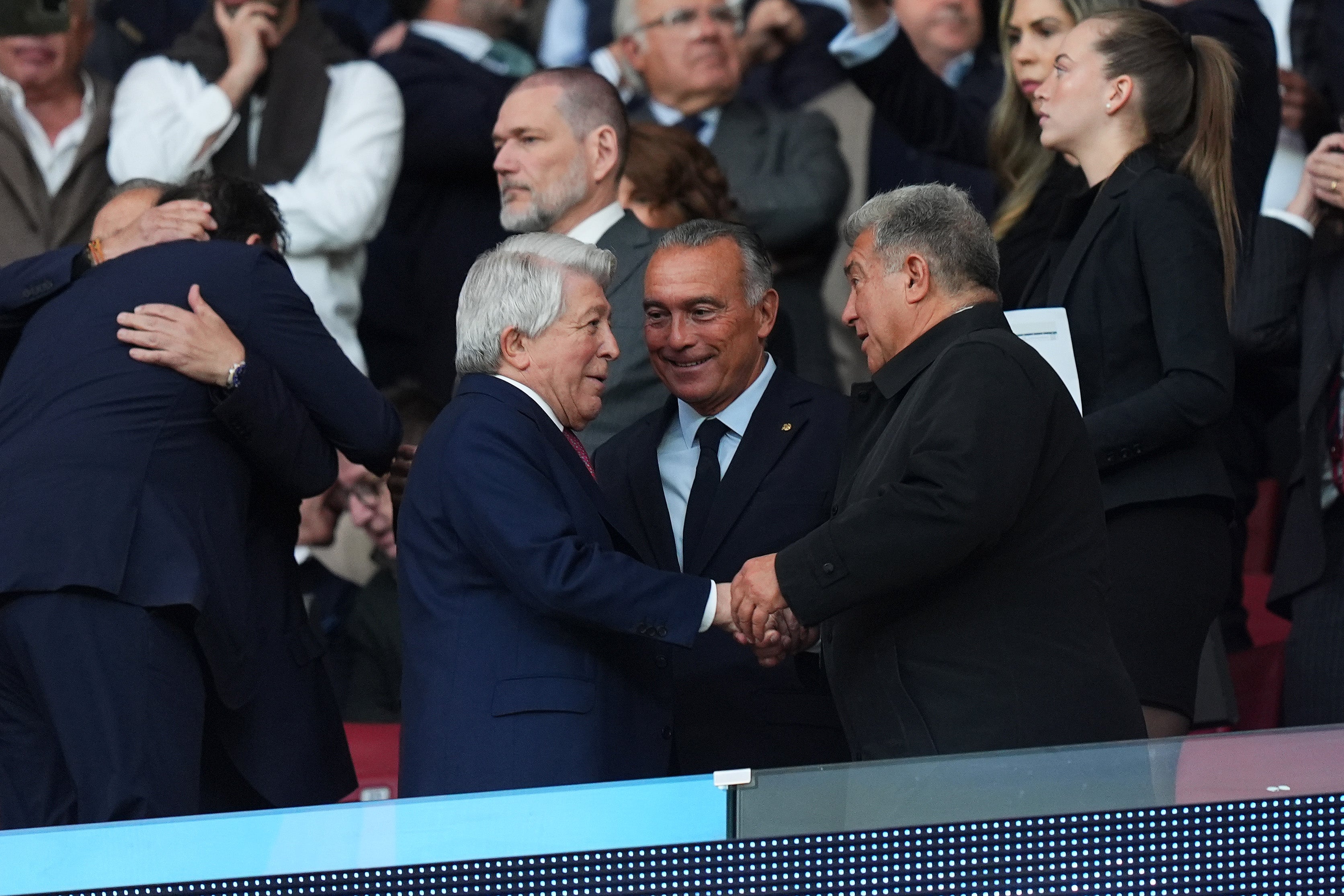 Enrique Cerezo, President of Atletico de Madrid, shakes hands with Joan Laporta, President of FC Barcelona