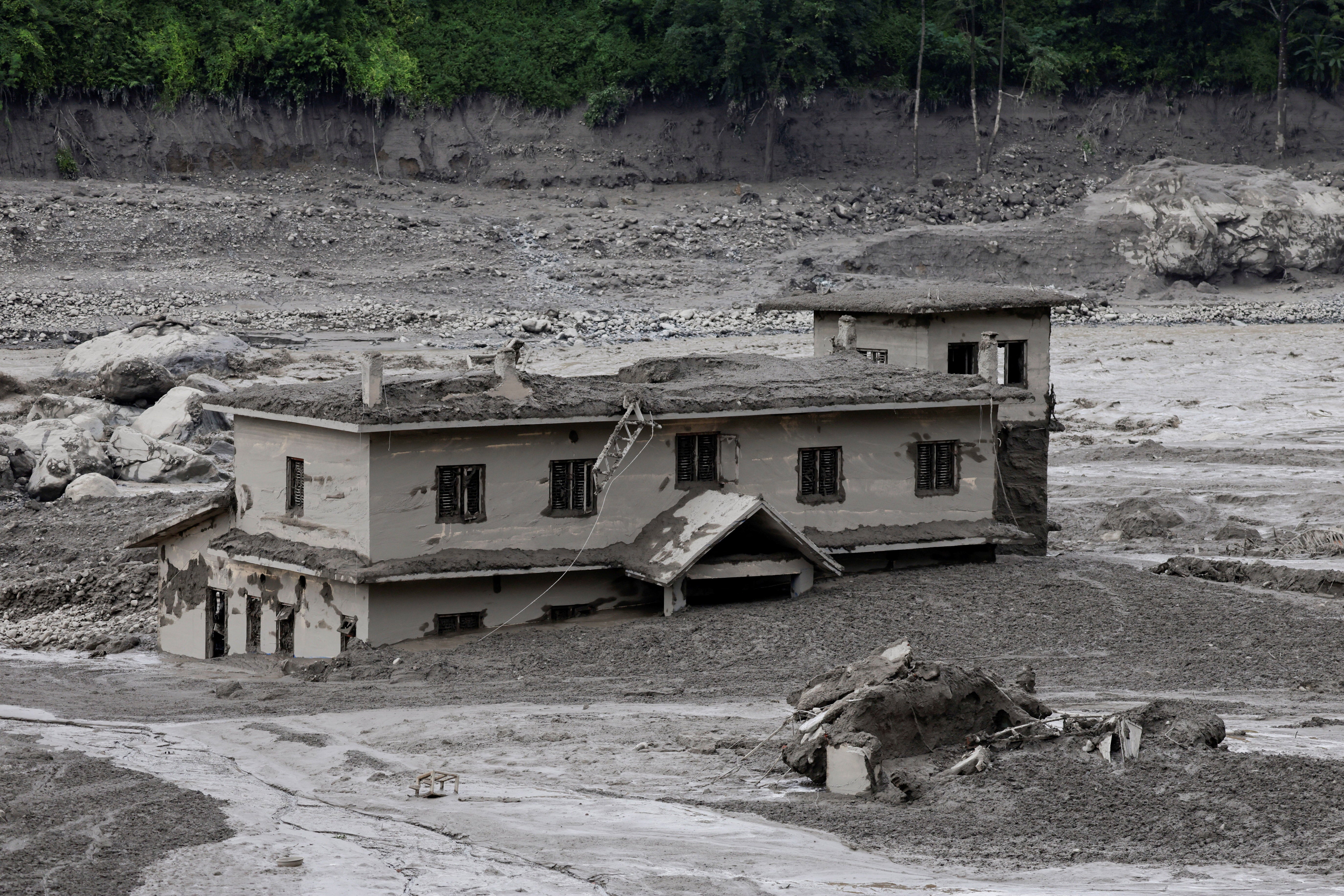 A mud-covered building following a flash flood at Trishuli in Nuwakot district, Nepal (Reuters)