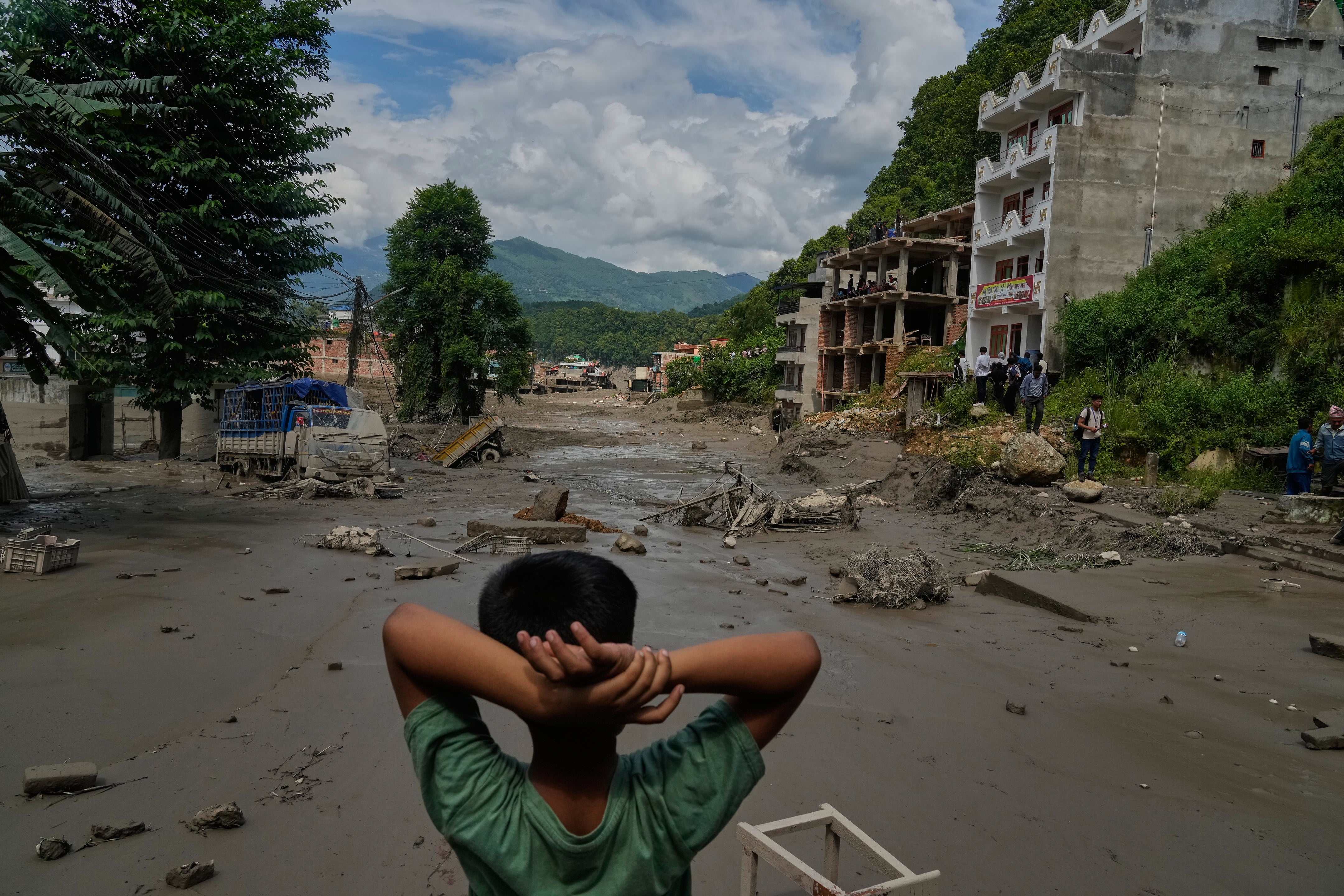 Flash flood hits northern Nepal near Tibet border; bridge collapse caught on video as waters surge