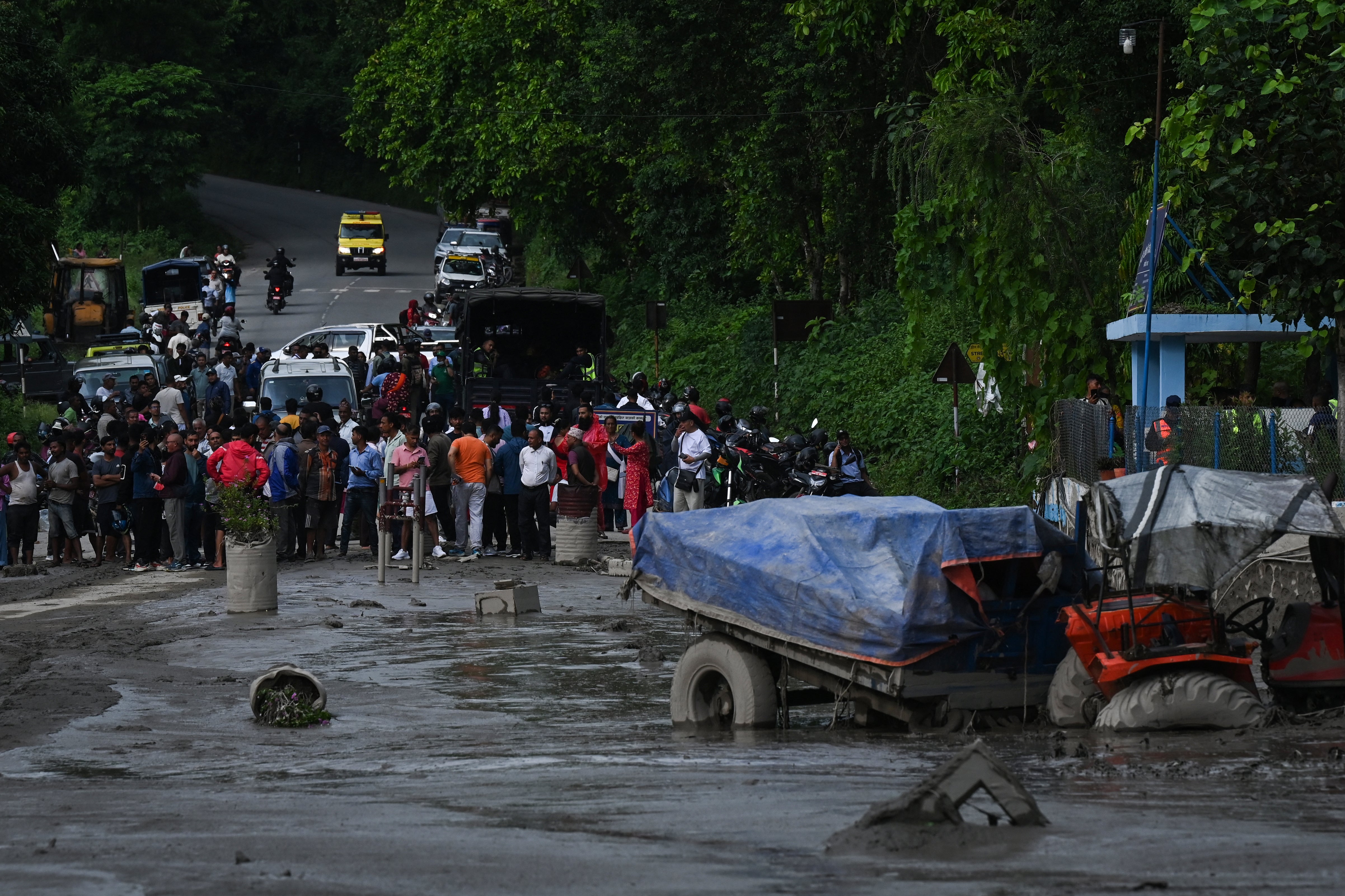 Houses and vehicles were swept away (AFP/Getty)