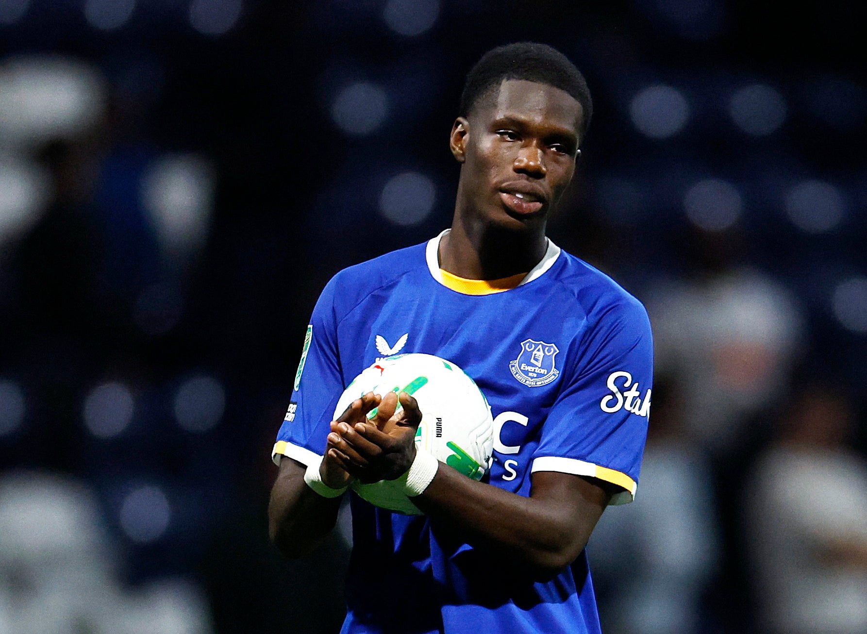 Thierno Barry celebrates with the match ball following his first Everton hat-trick