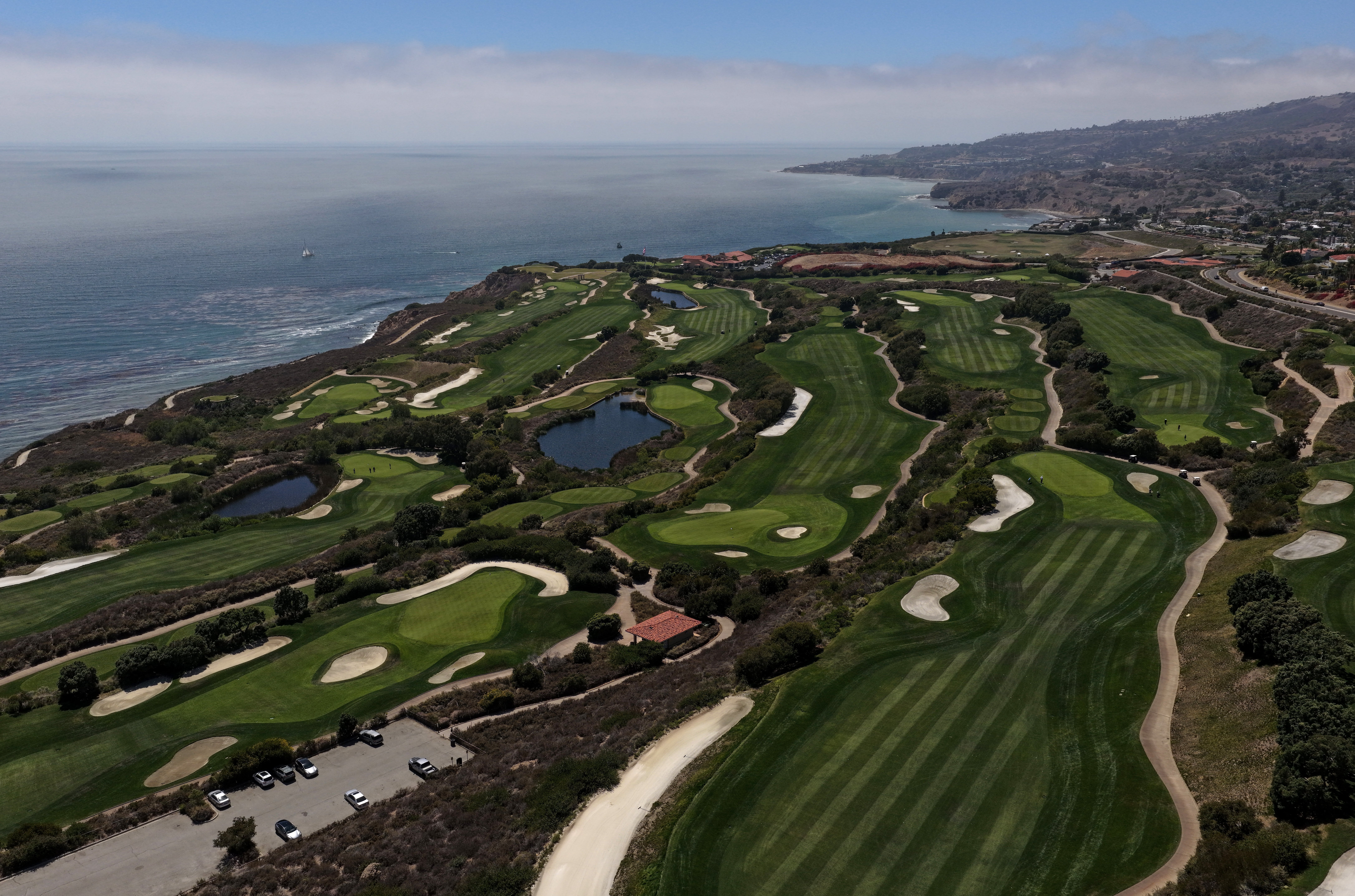 When Taele was arrested earlier this month, he was seen wearing an earpiece and taking pictures of the golf course where Trump was scheduled to attend a Republican National Committee dinner. (Justin Sullivan/Getty Images)