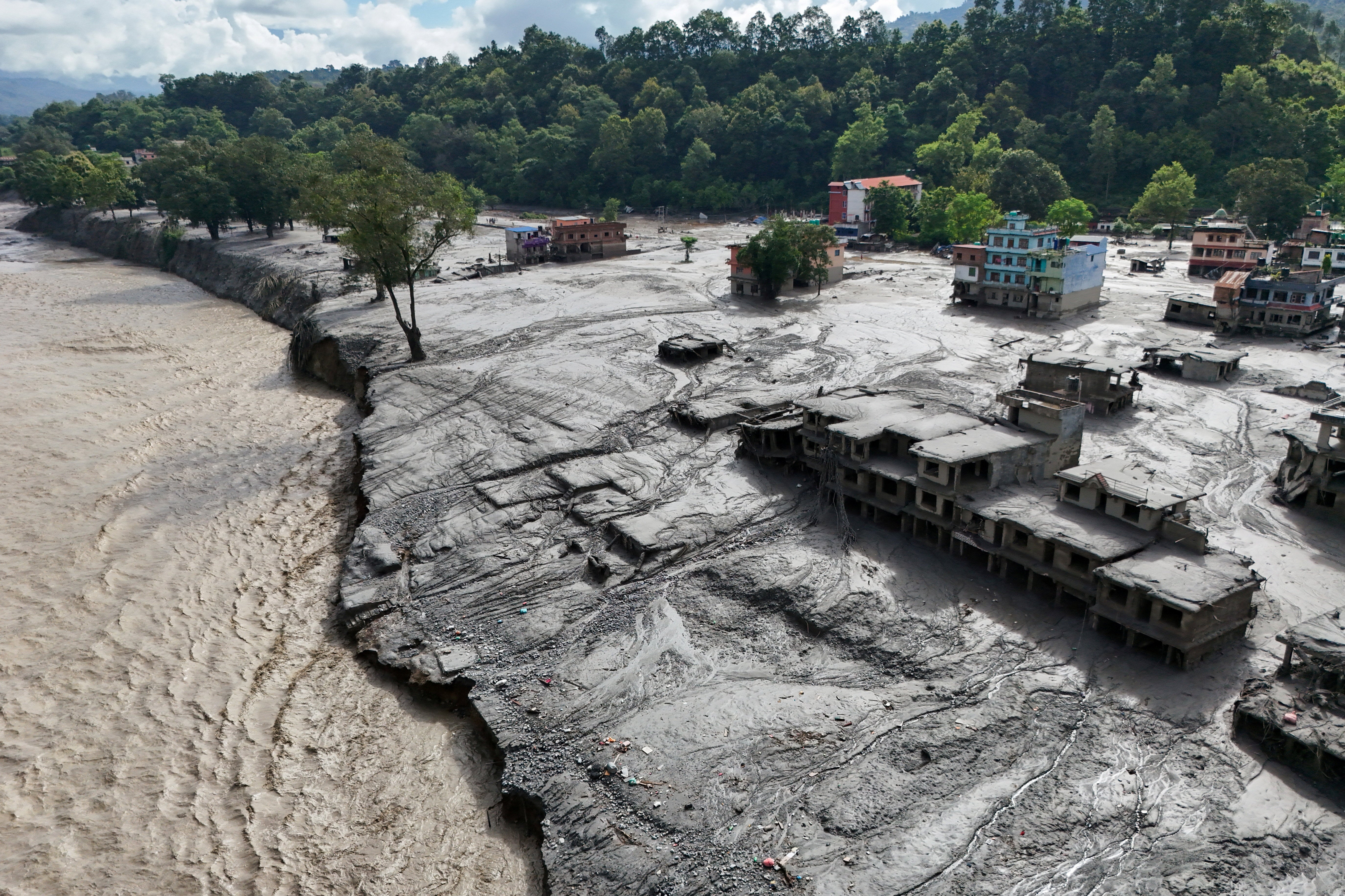 A drone view shows mud covering buildings and property following devastating floods at Trishuli in Nuwakot district (Reuters)