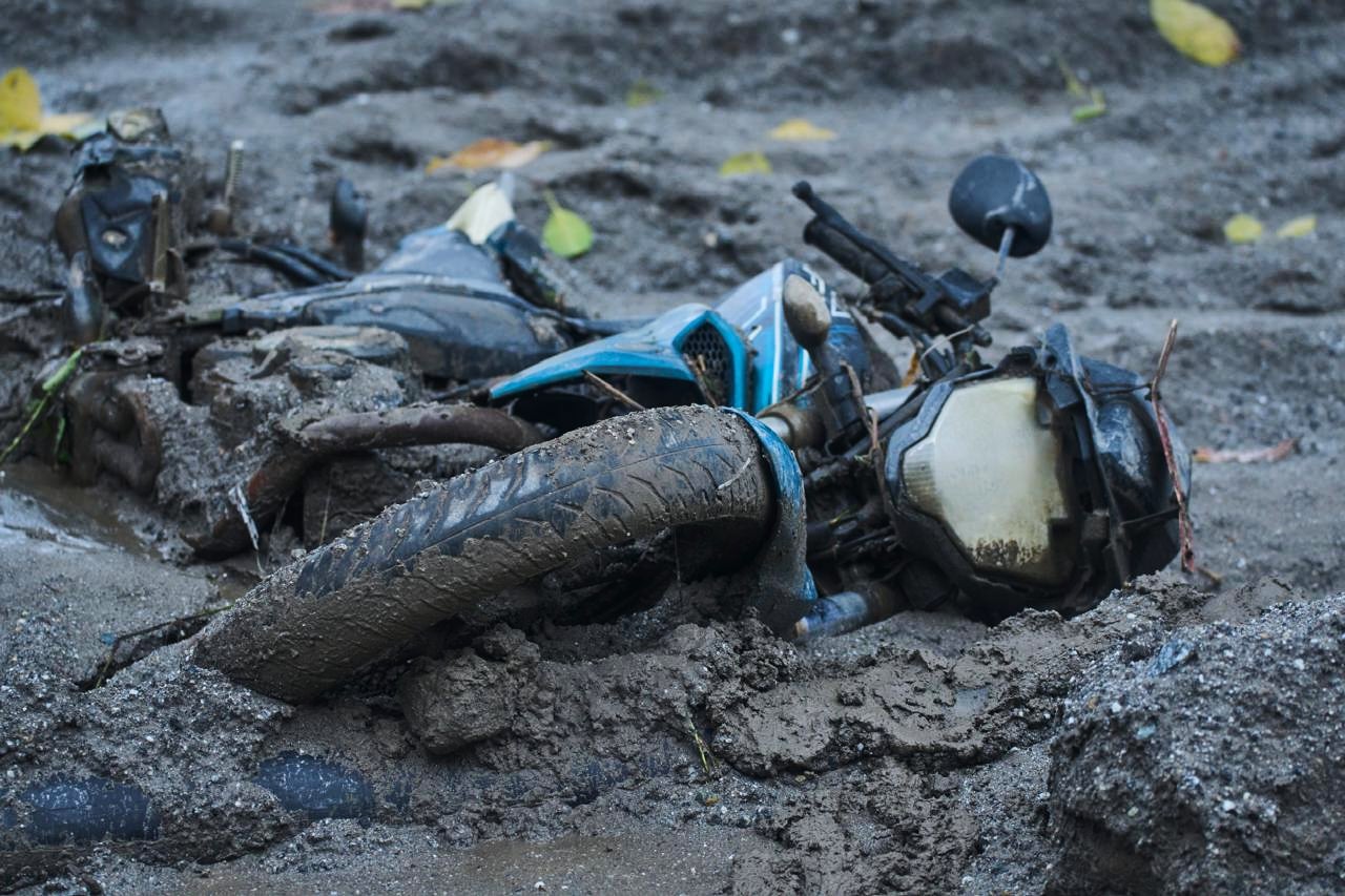 A two-wheeler lies in the aftermath of flash floods in Devighat in the Nuwakot district in Nepal, Thursday, 27 August 2026