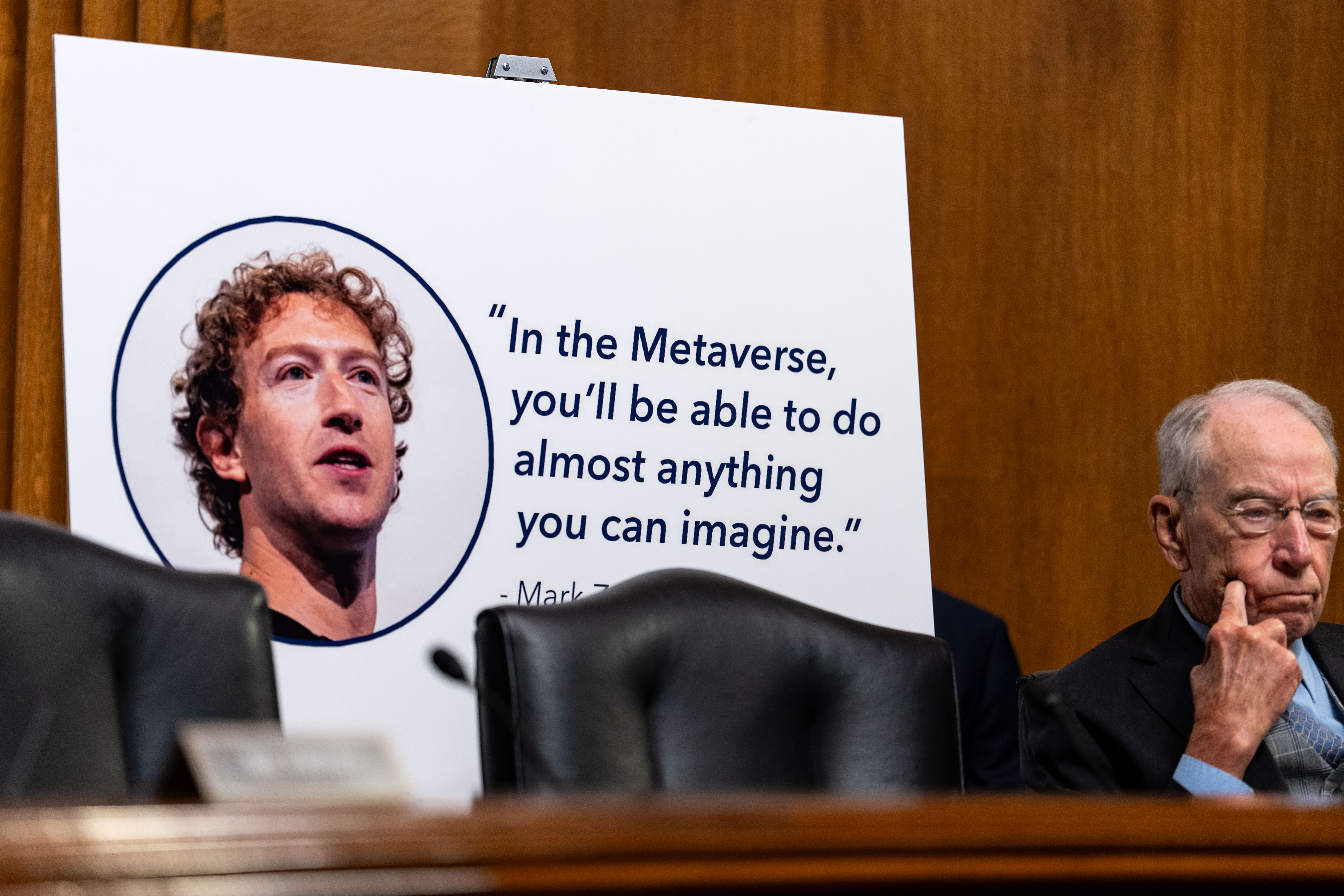 A poster of Meta CEO Mark Zuckerberg is displayed as former Meta researchers Jason Sattizahn and Cayce Savage testify during a Senate Judiciary Subcommittee on Privacy, Technology, and the Law hearing titled 