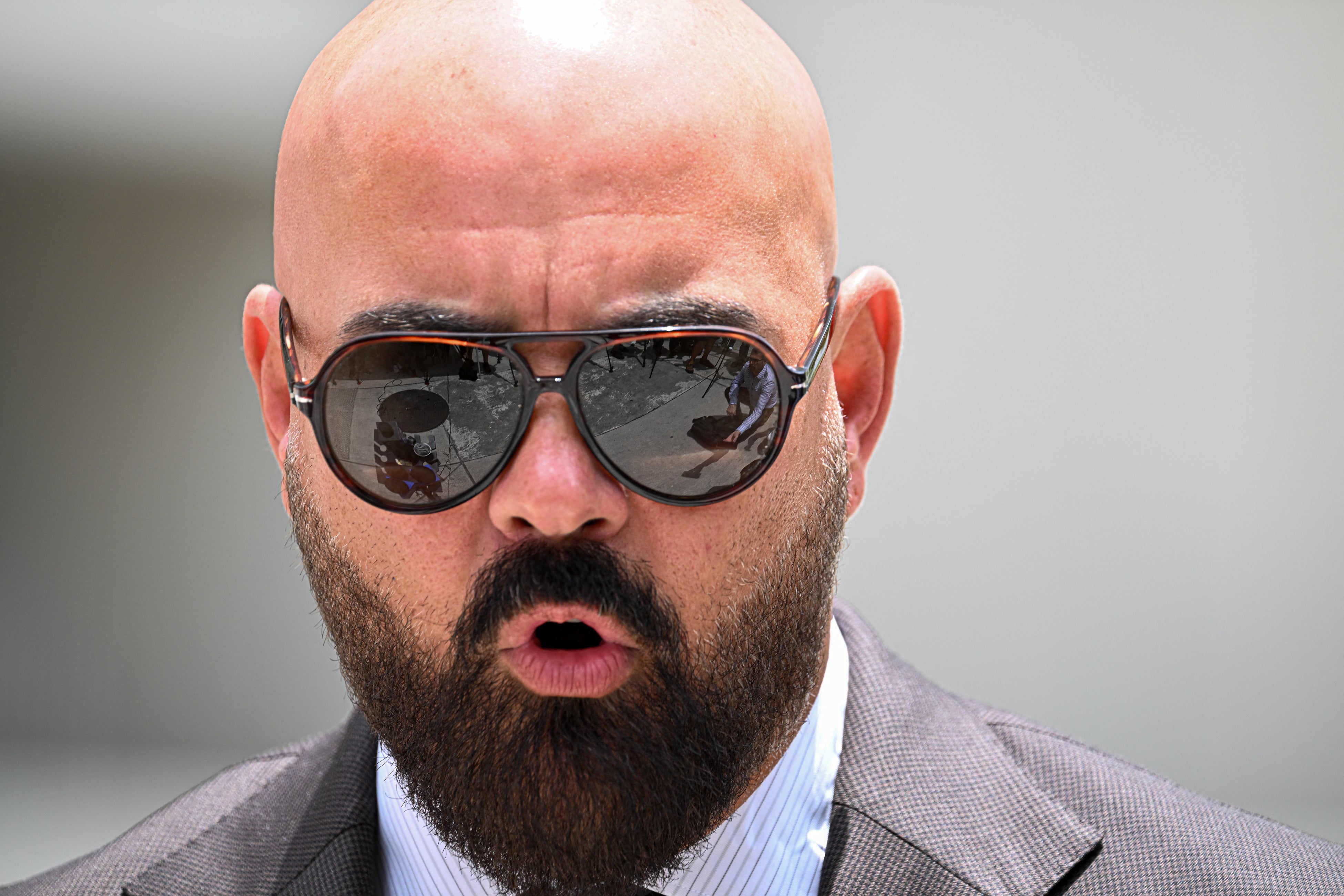 Joseph D. McBride, attorney for Andrew Tate and Tristan Tate, speaks to the press following an extradition hearing for the Tate brothers at the C. Clyde Atkins US Courthouse in Miami, Florida, on July 27