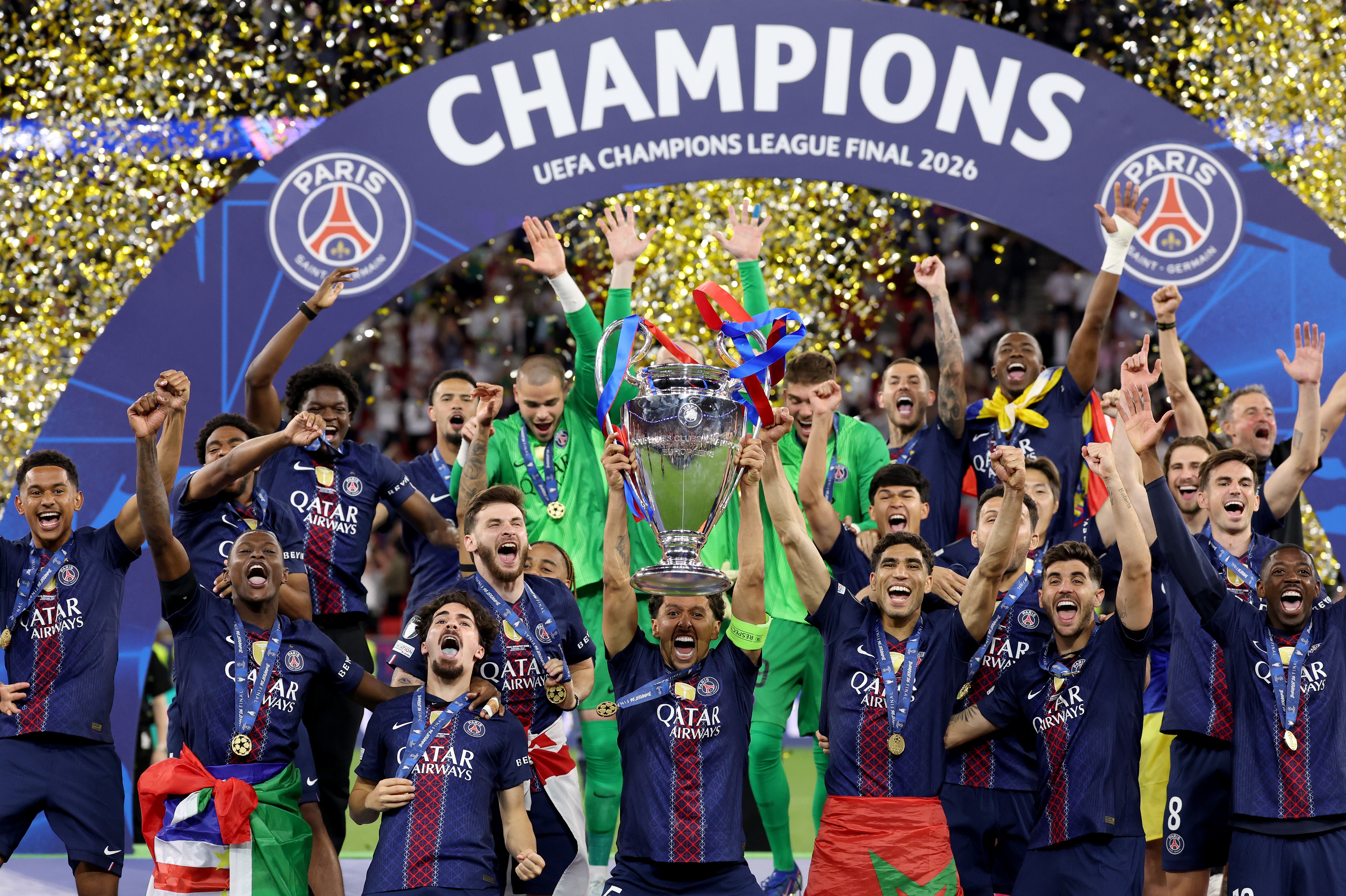 Marquinhos of Paris Saint-Germain lifts the UEFA Champions League trophy