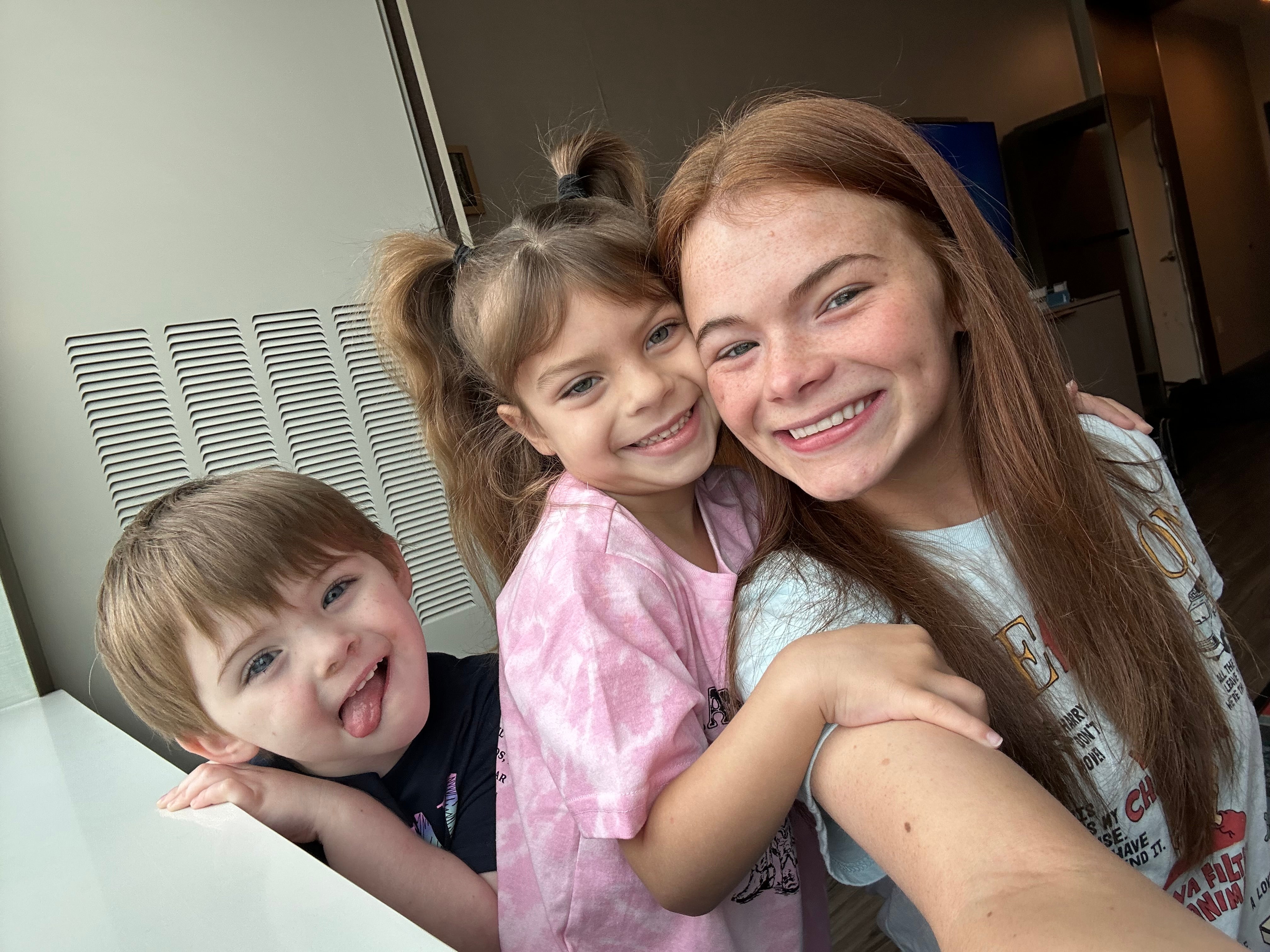 Griffin, pictured during the throes of postpartum psychosis last year with stepdaughter Ava, 6, and Thomas, 4. She said her symptoms included hearing voices and hallucinations that made her ‘lose touch with reality’