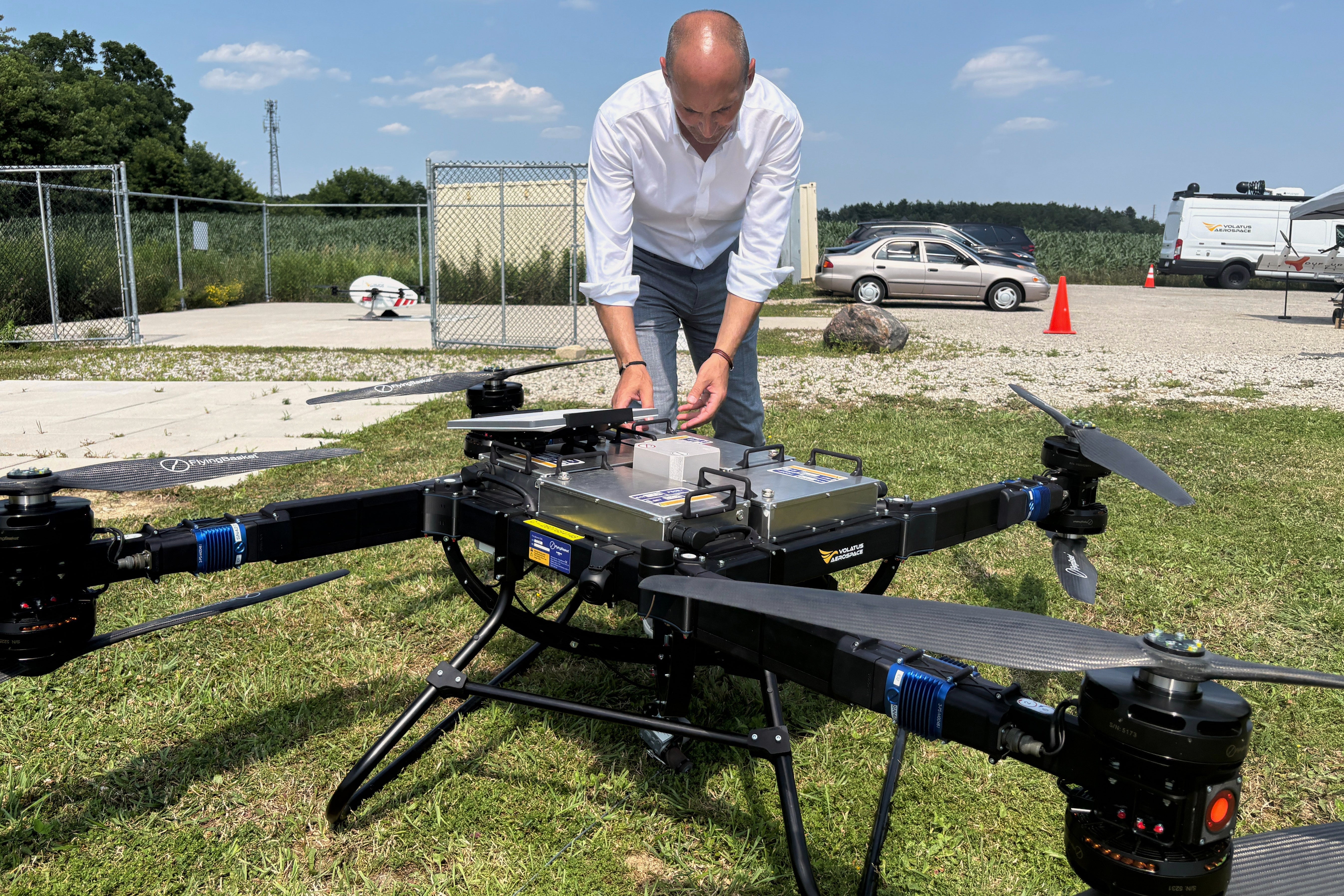 Volatus Aerospace COO Greg Colacitti inspects a heavy lift drone before a test run on July 13, 2026, in Kleinburg, Ontario