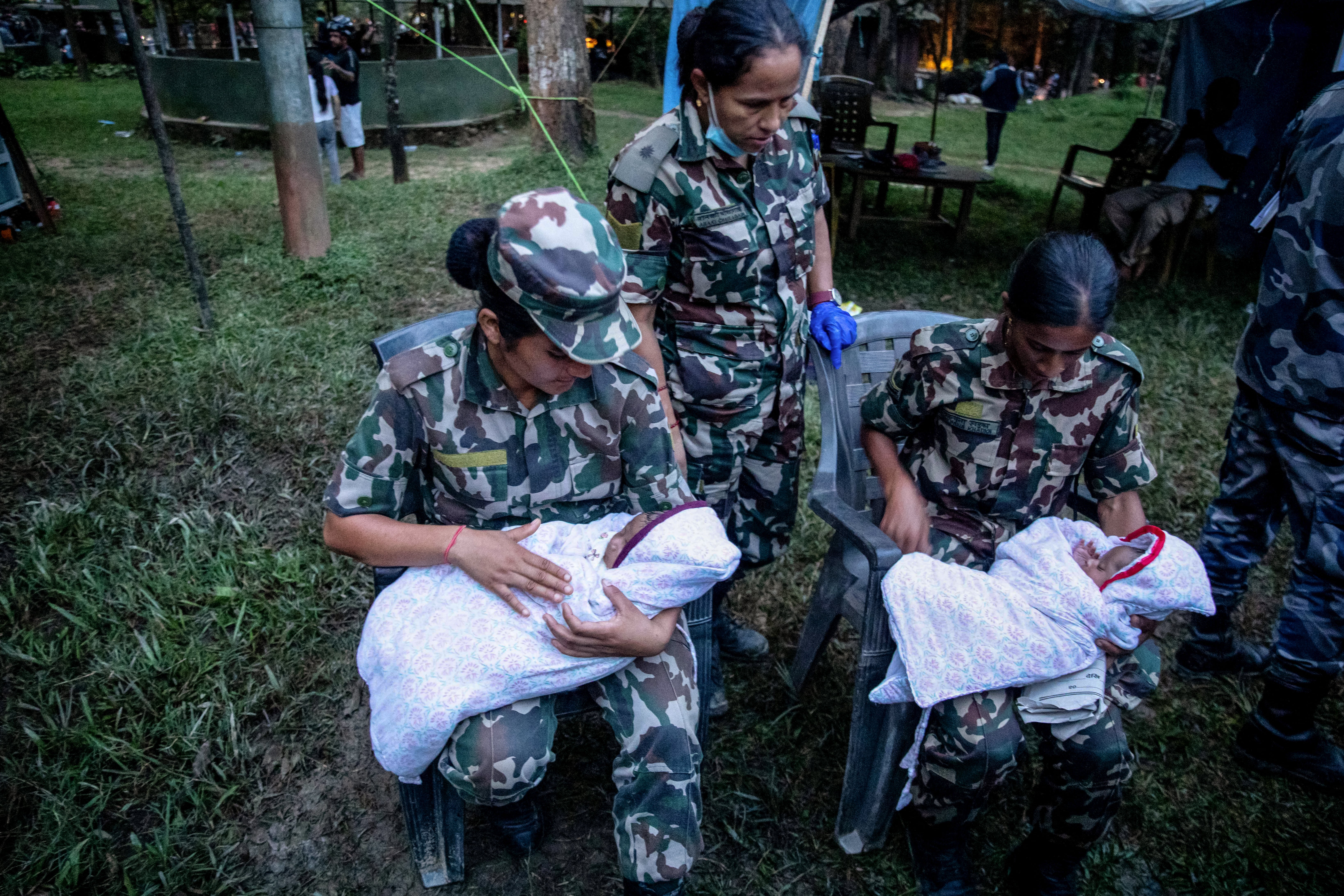 Nepali soldiers comfort twin infants during rescue operations (AFP/Getty)