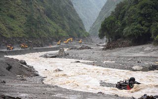 Excavators and loaders in action as rescue workers repair a road leading to Gyirong Port after a mudslide, in Gyirong county, Shigatse, Tibet Autonomous Region, China 28 August 2026