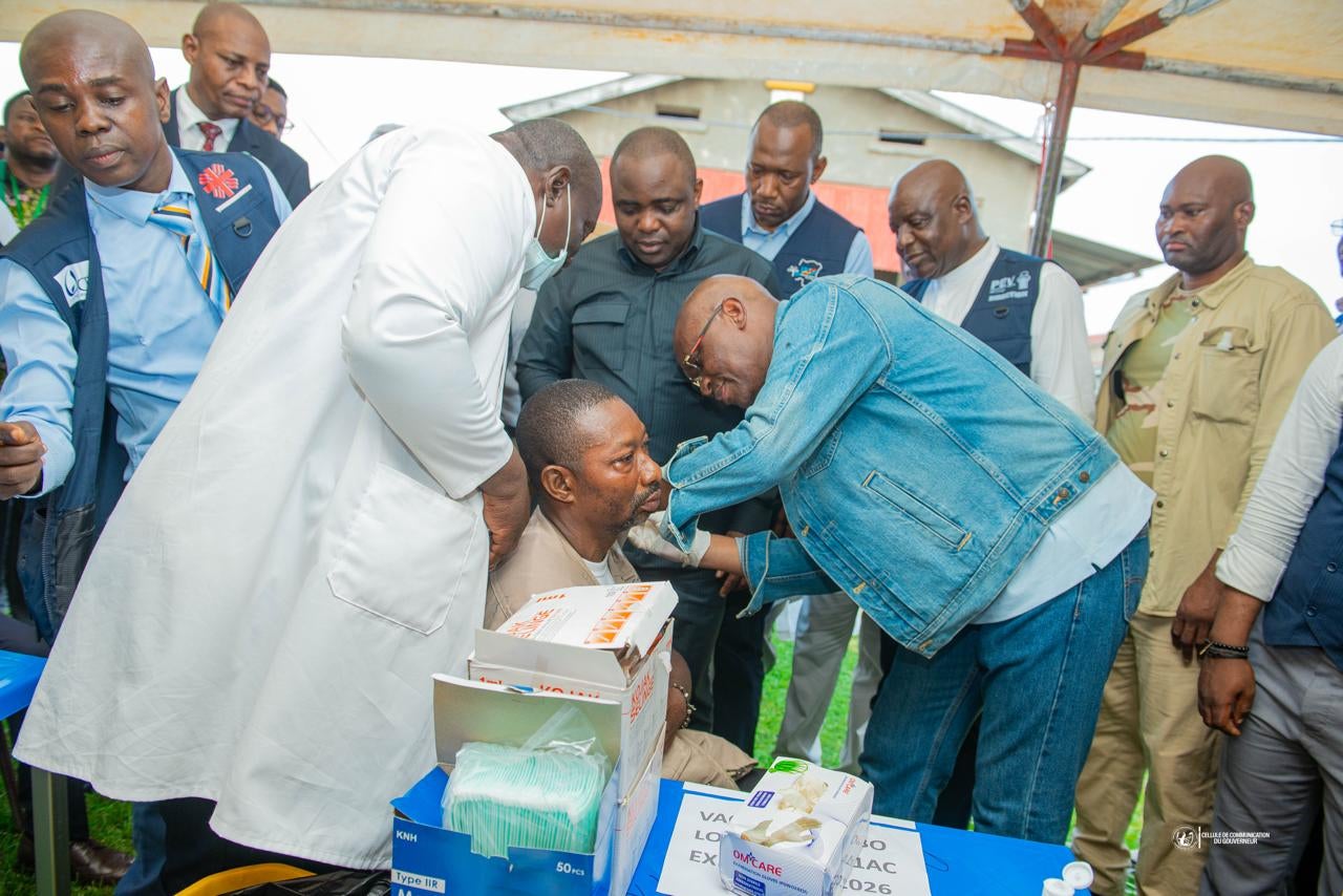 Congo’s Health Minister Roger Kamba administers an Ebola vaccine to a health care worker in Kisangani, Congo.