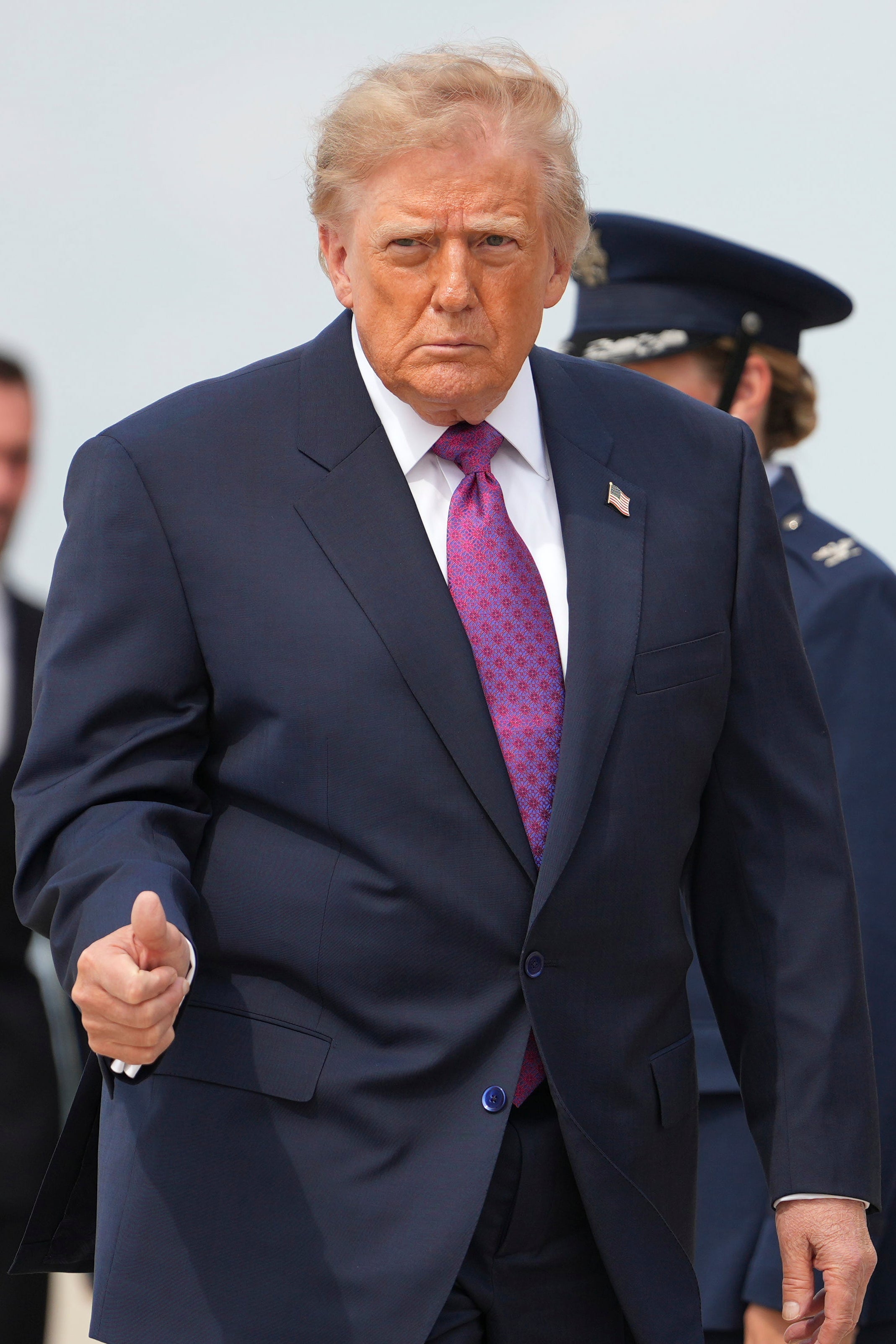 President Donald Trump walks to board Air Force One, Thursday, Aug. 27