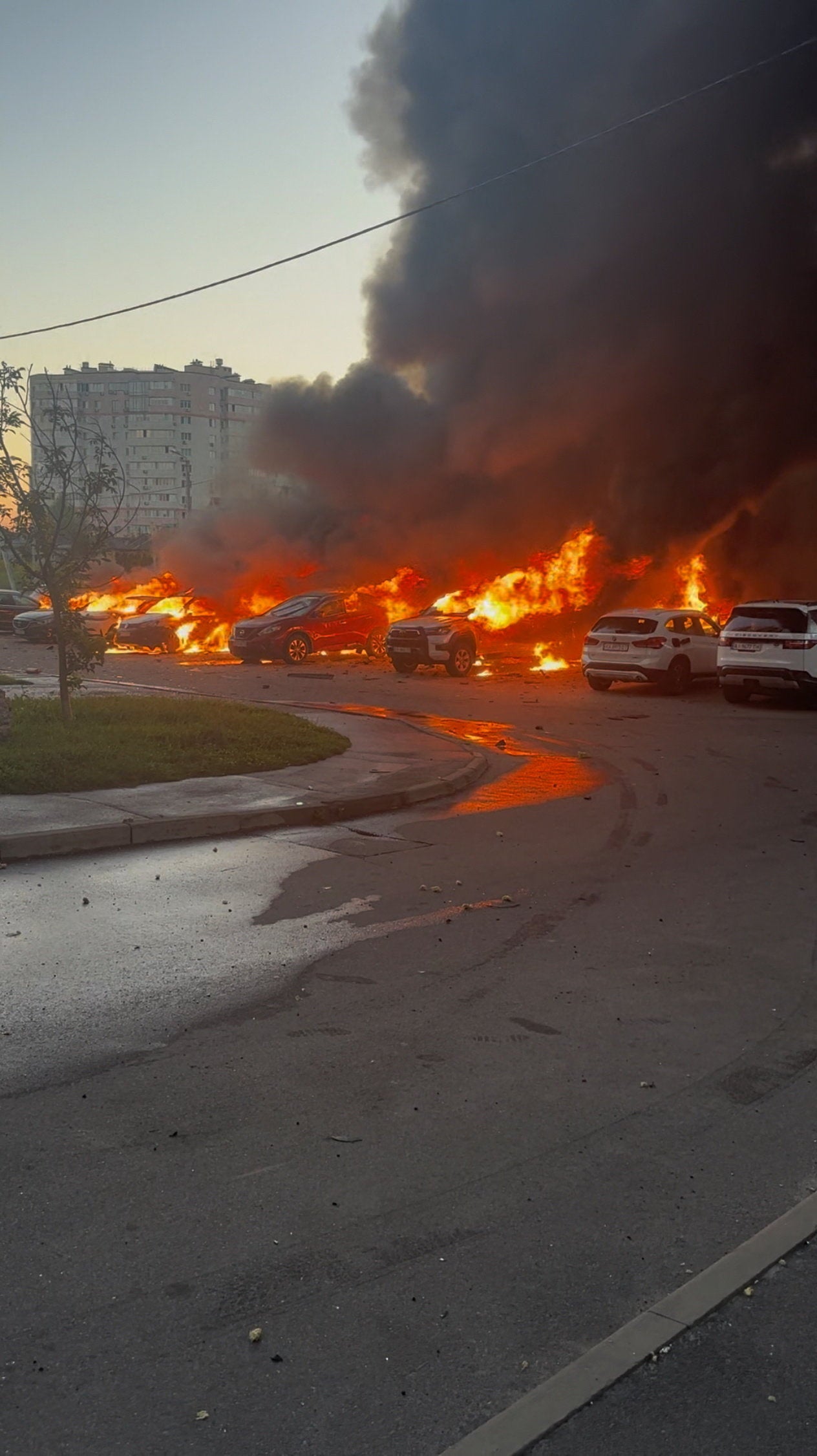 Vehicles burn in the aftermath of a Russian drone strike in the town of Vyshneve in Kyiv region, Ukraine, August 28