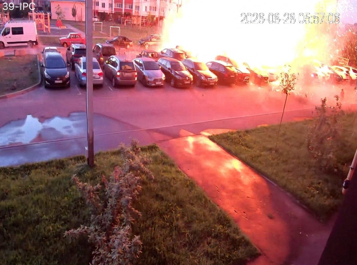 A screen grab from CCTV footage shows flames rising due to a Russian drone strike in the town of Vyshneve