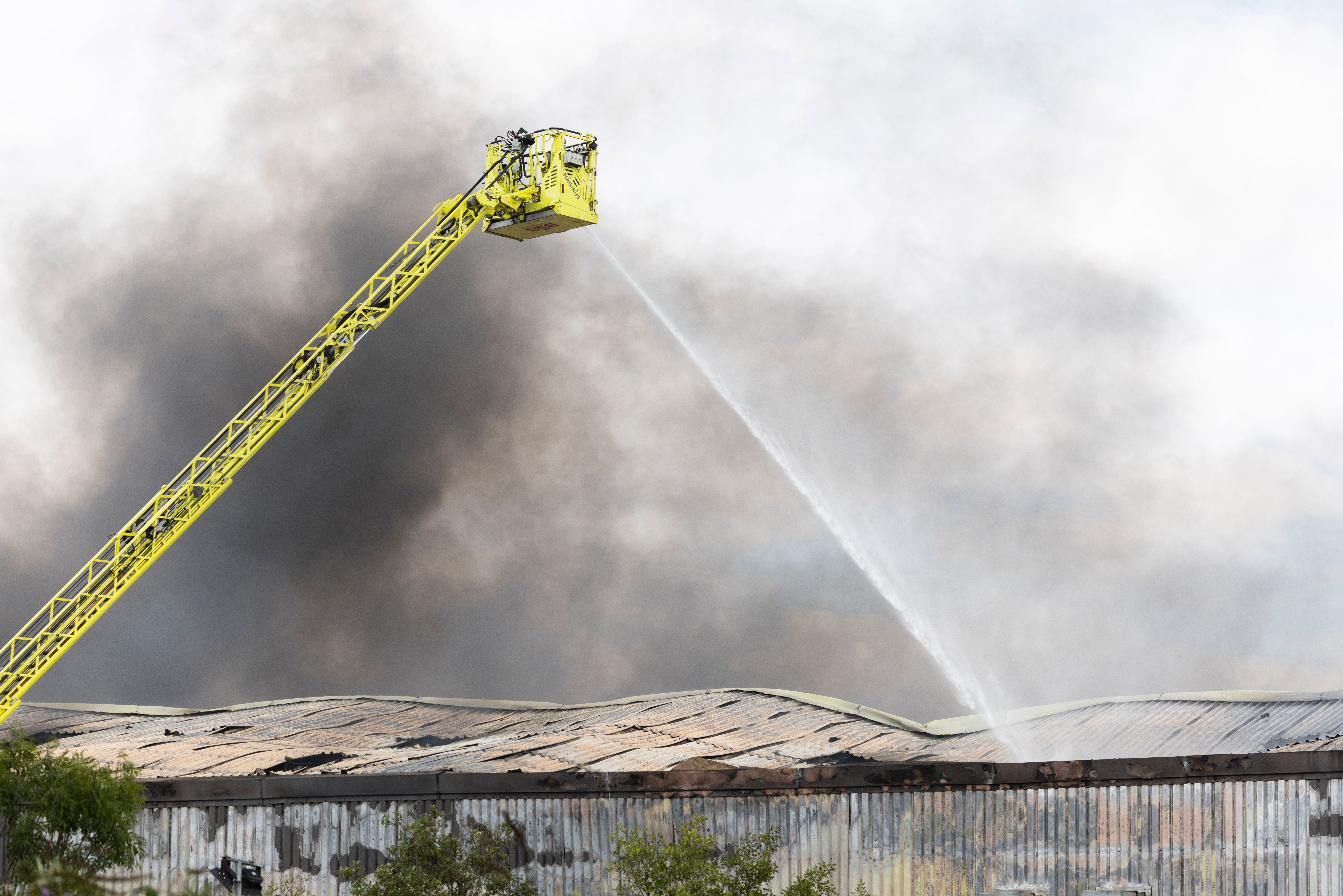 Firefighters are using aerial equipment (AFP/Getty)