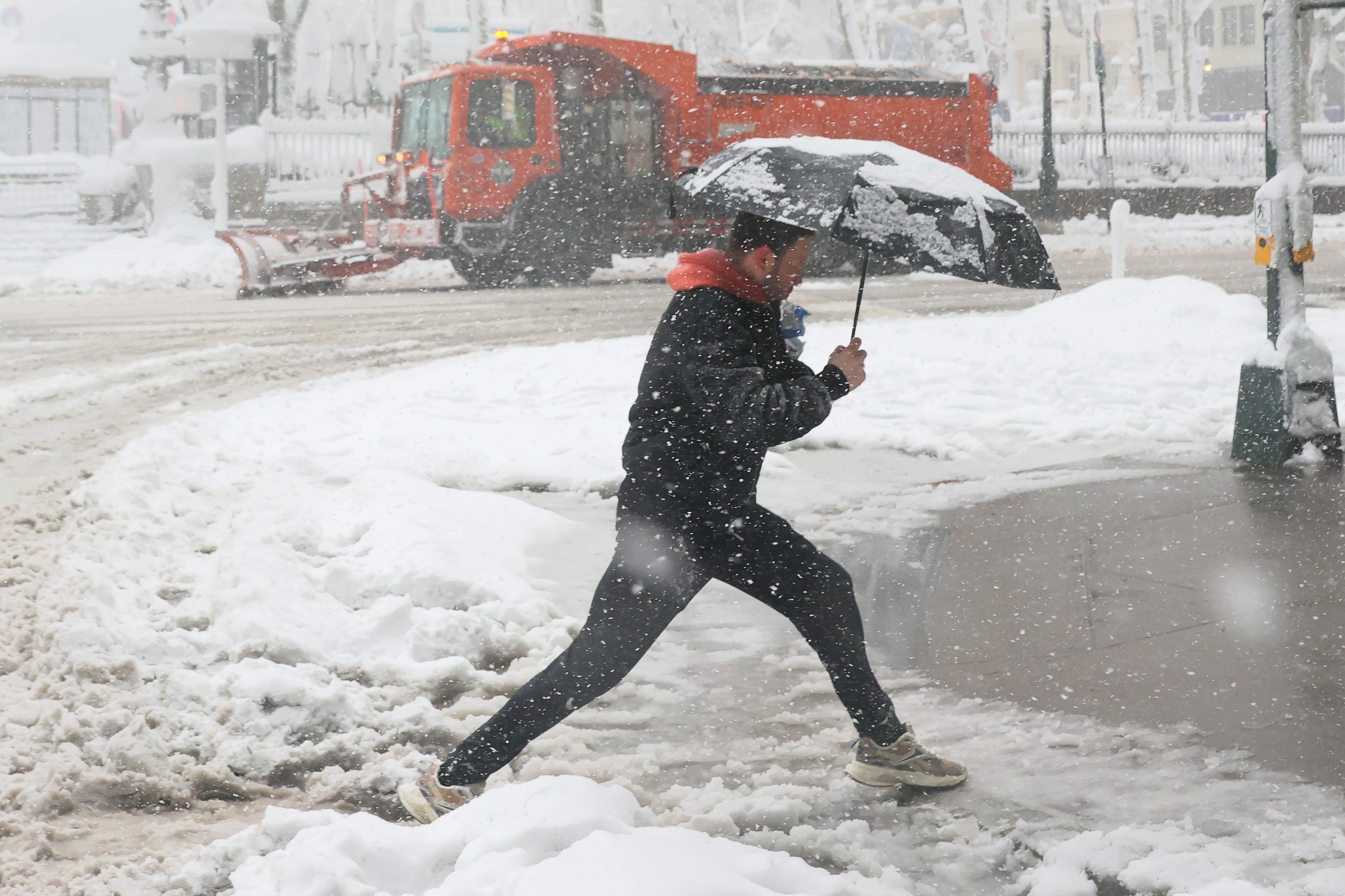 People walk in a blizzard in New York City in February. The Northeast is forecast to see snow and cooler temperatures again