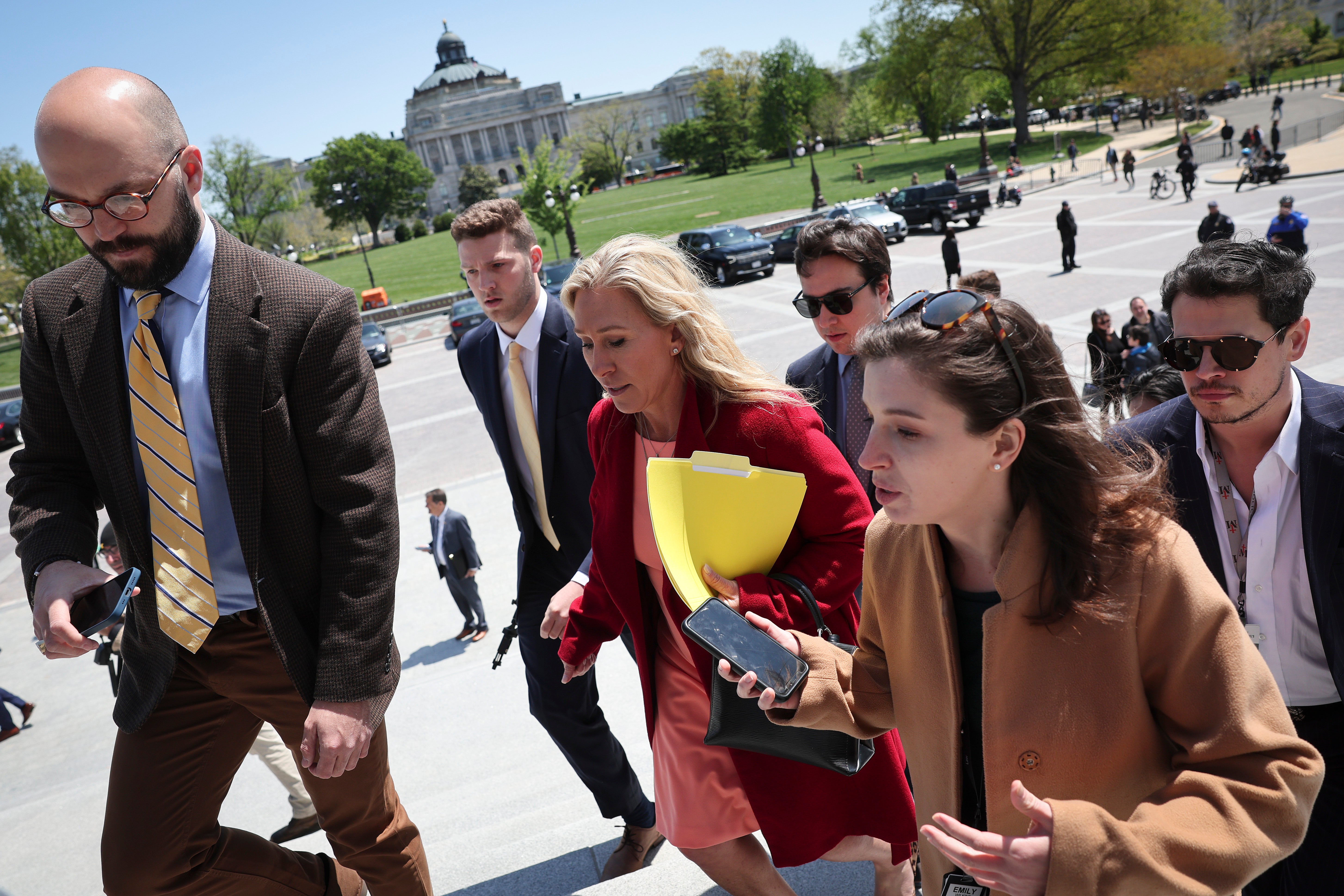 Milo Yiannopoulos (pictured right) is known for working for people aligned with far-right politics; for example, he interned with former Rep. Marjorie Taylor Greene (pictured center)