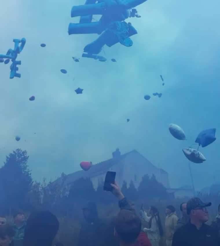 Blue flares and balloons were released for Michael Cahill