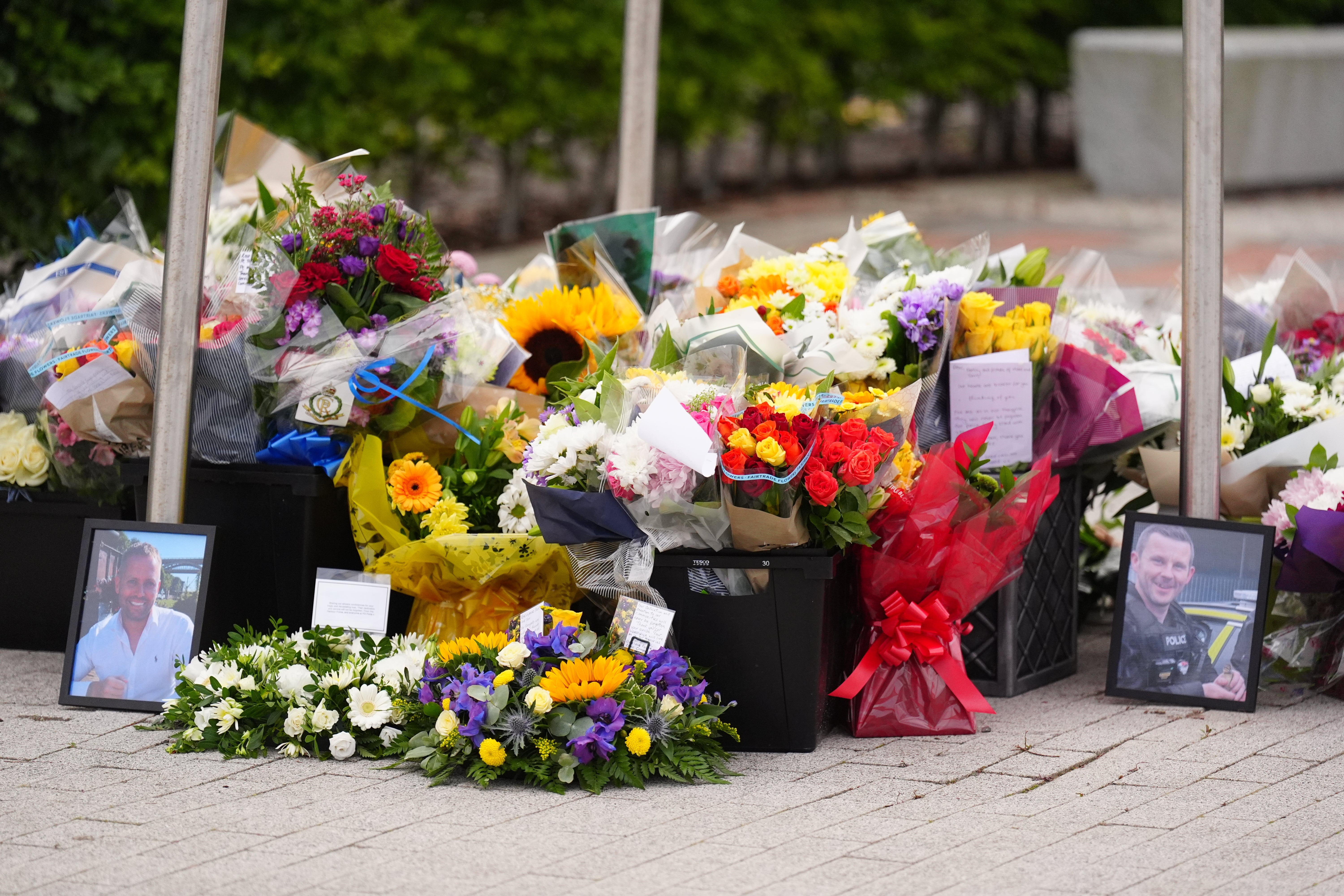 People left floral tributes to Pc Clough and Pc Blades at the Cleveland Police HQ in Middlesbrough
