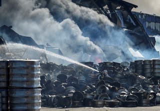 A firefighter works at a site of a Russian drone strike, amid Russia's attack on Ukraine, in Kyiv, Ukraine August 29, 2026