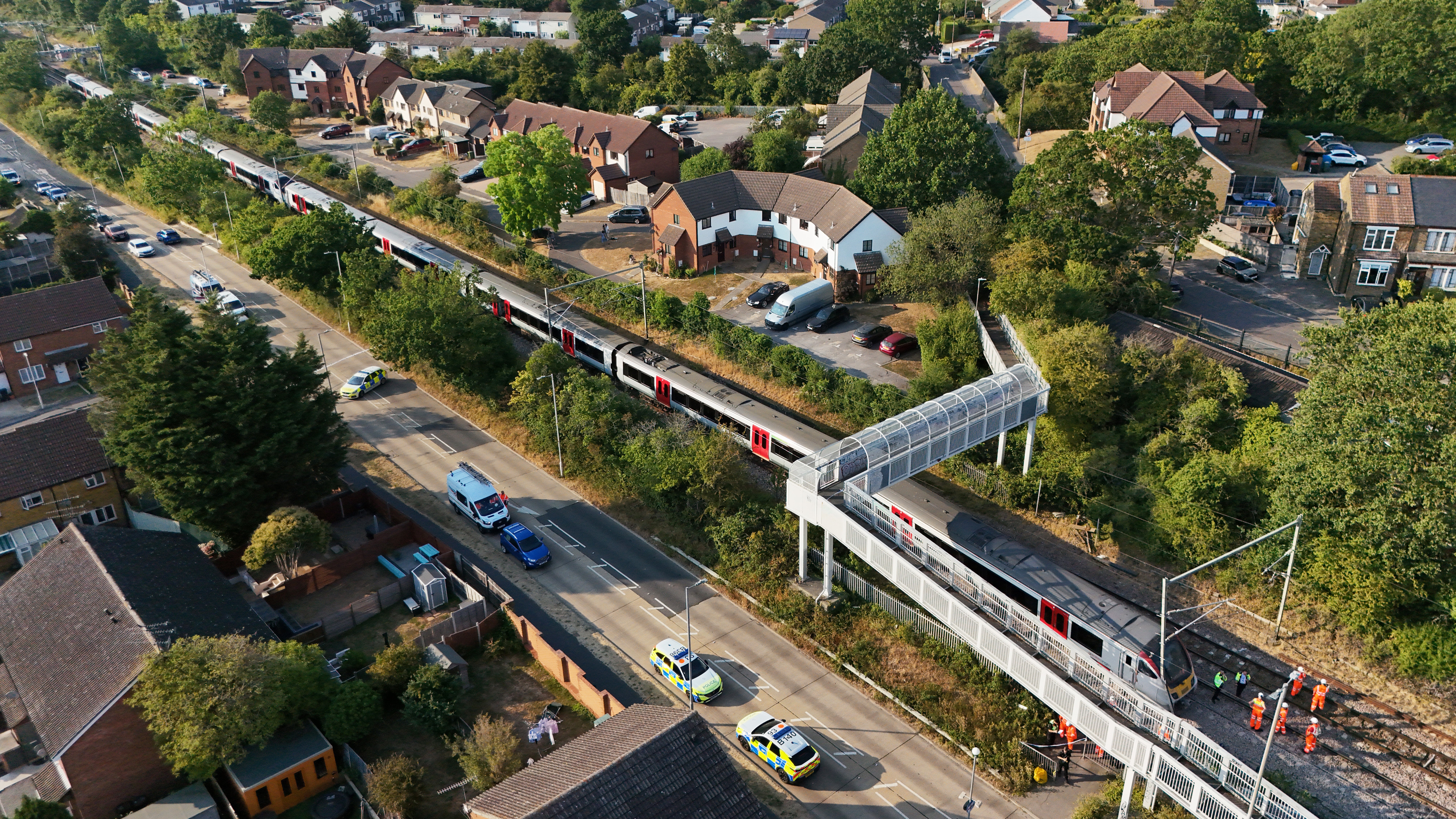 Rail workers at the scene near to Salcott Crescent, Wickford (PA)
