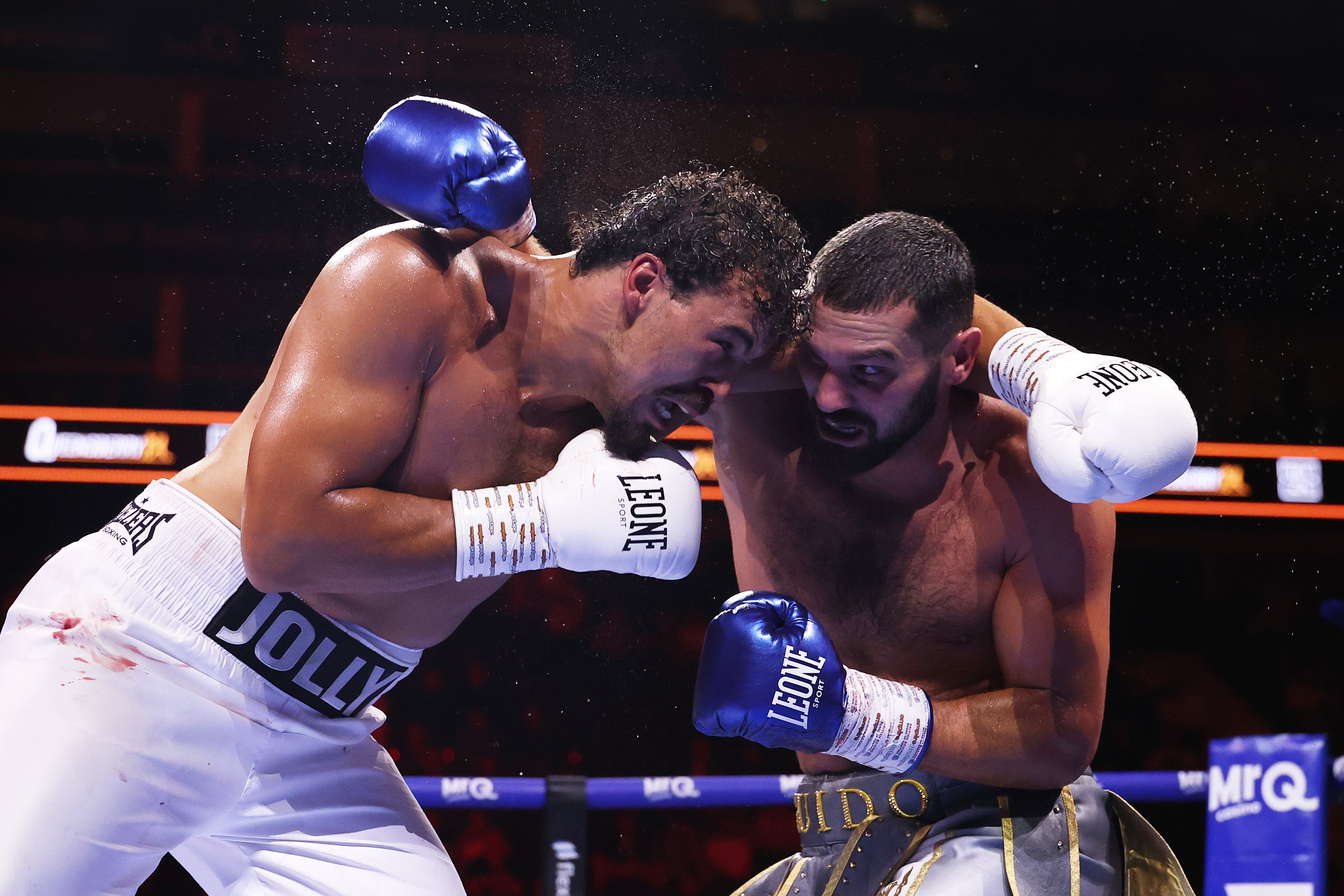 Moses Jolly (left) and Guido Vianello in their chaotic fight