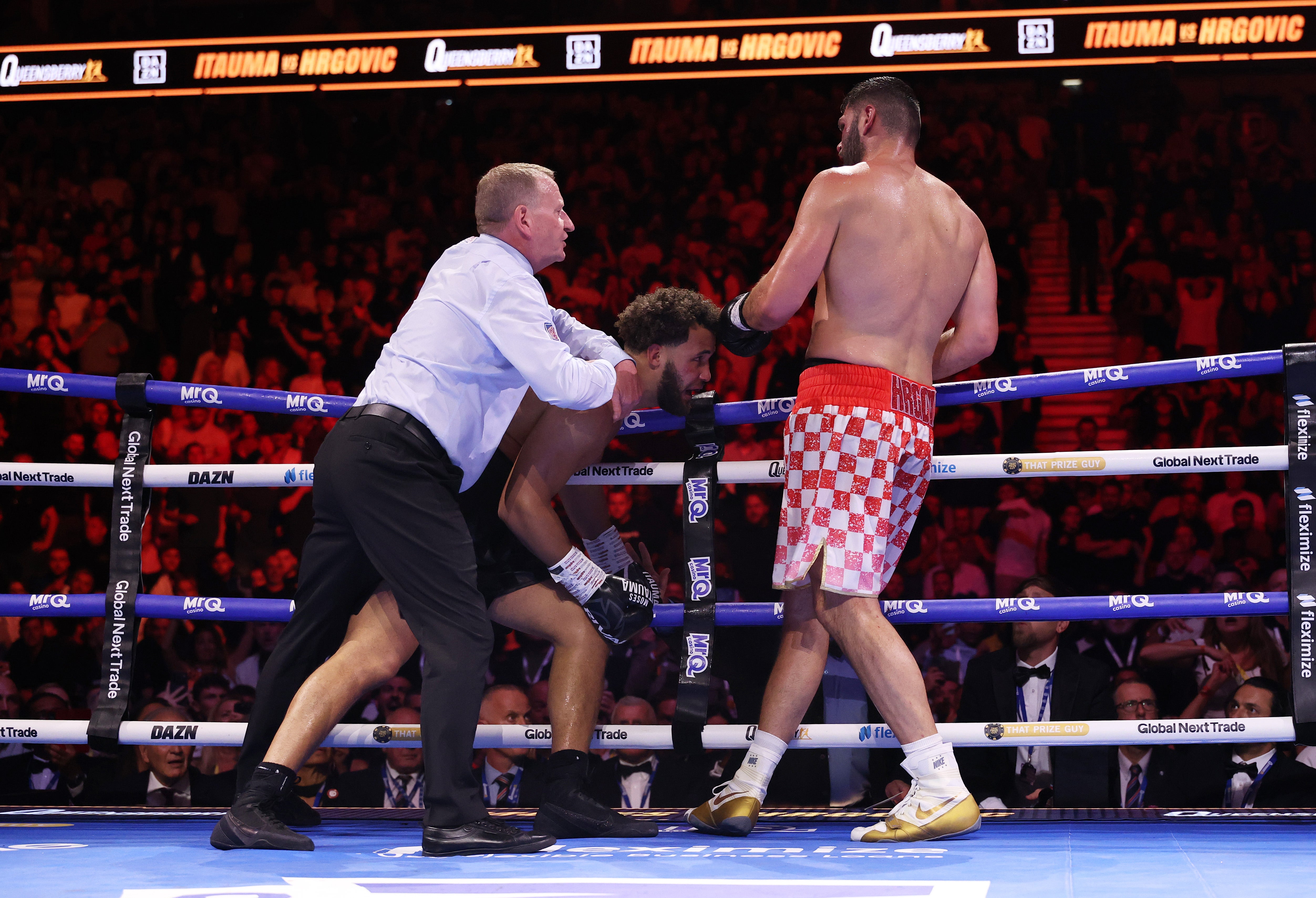 Referee Howard Foster stops the fight as Moses Itauma’s corner throw in the towel