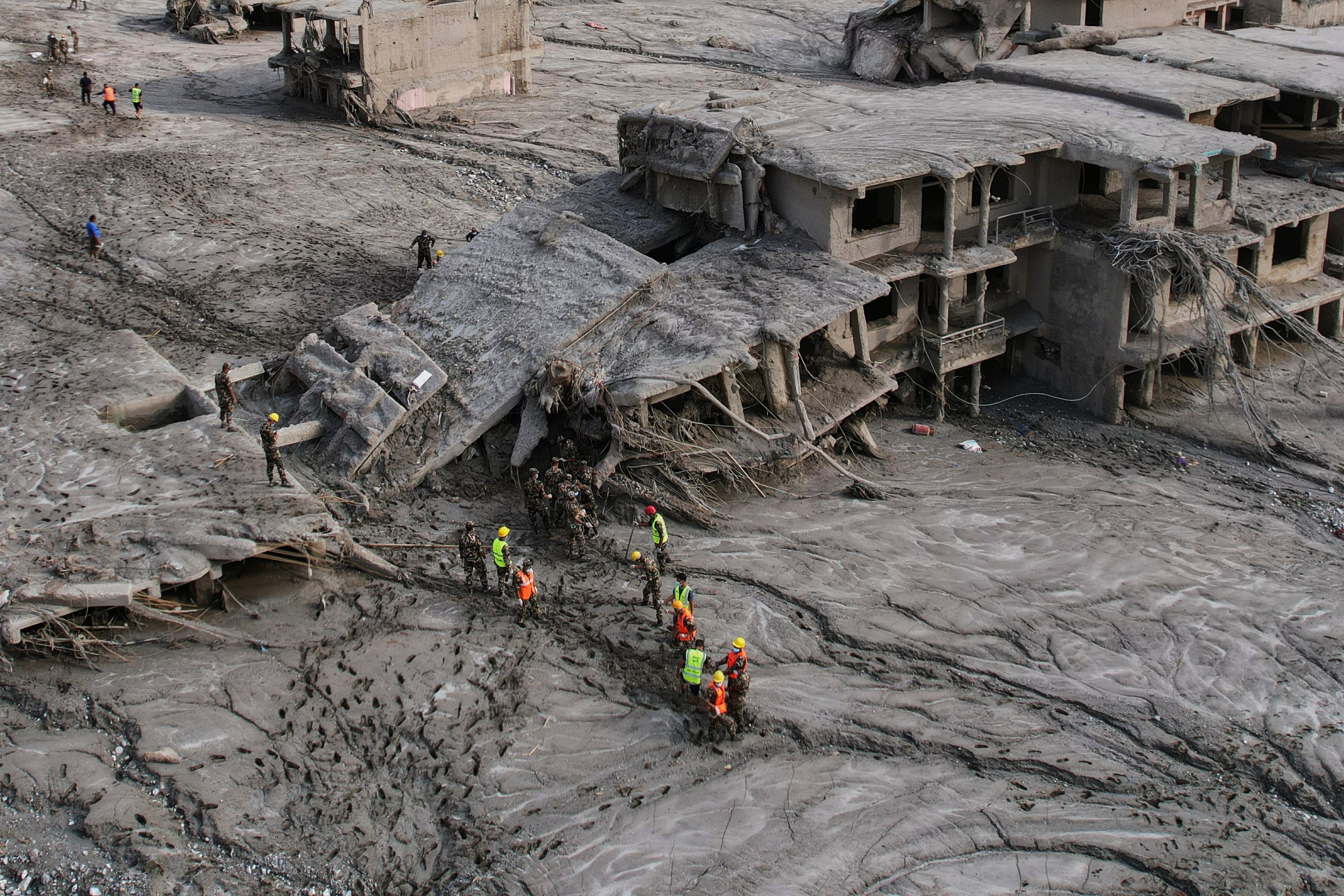 Searches continue for thousands missing as Nepal flood death toll tops 670; UK sends rapid deployment team and £5M aid