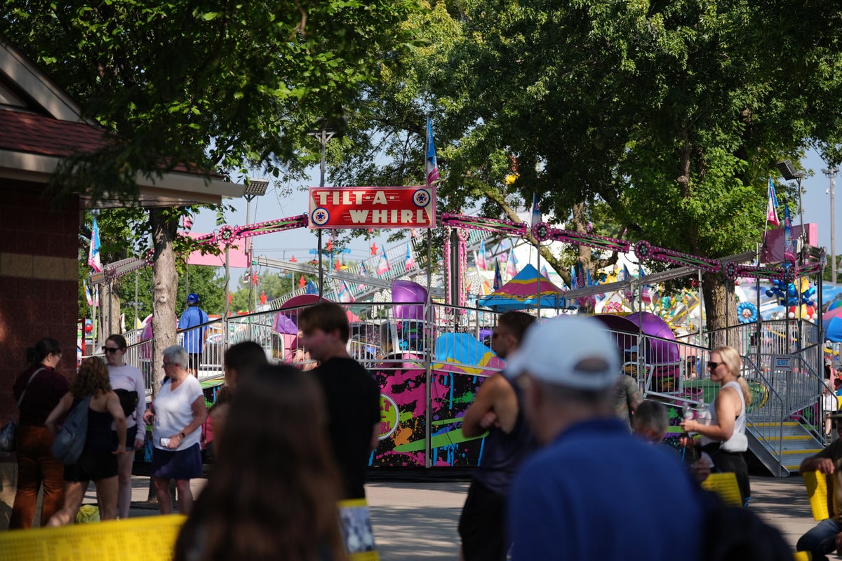 Spinning and dipping, Minnesota fairgoers delight in the classic Tilt-A-Whirl ride as it turns 100