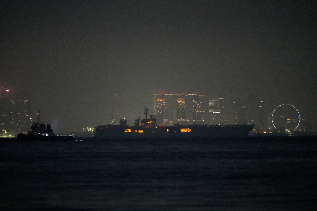 USS Abraham Lincoln sails past Singapore on its way home from Middle East