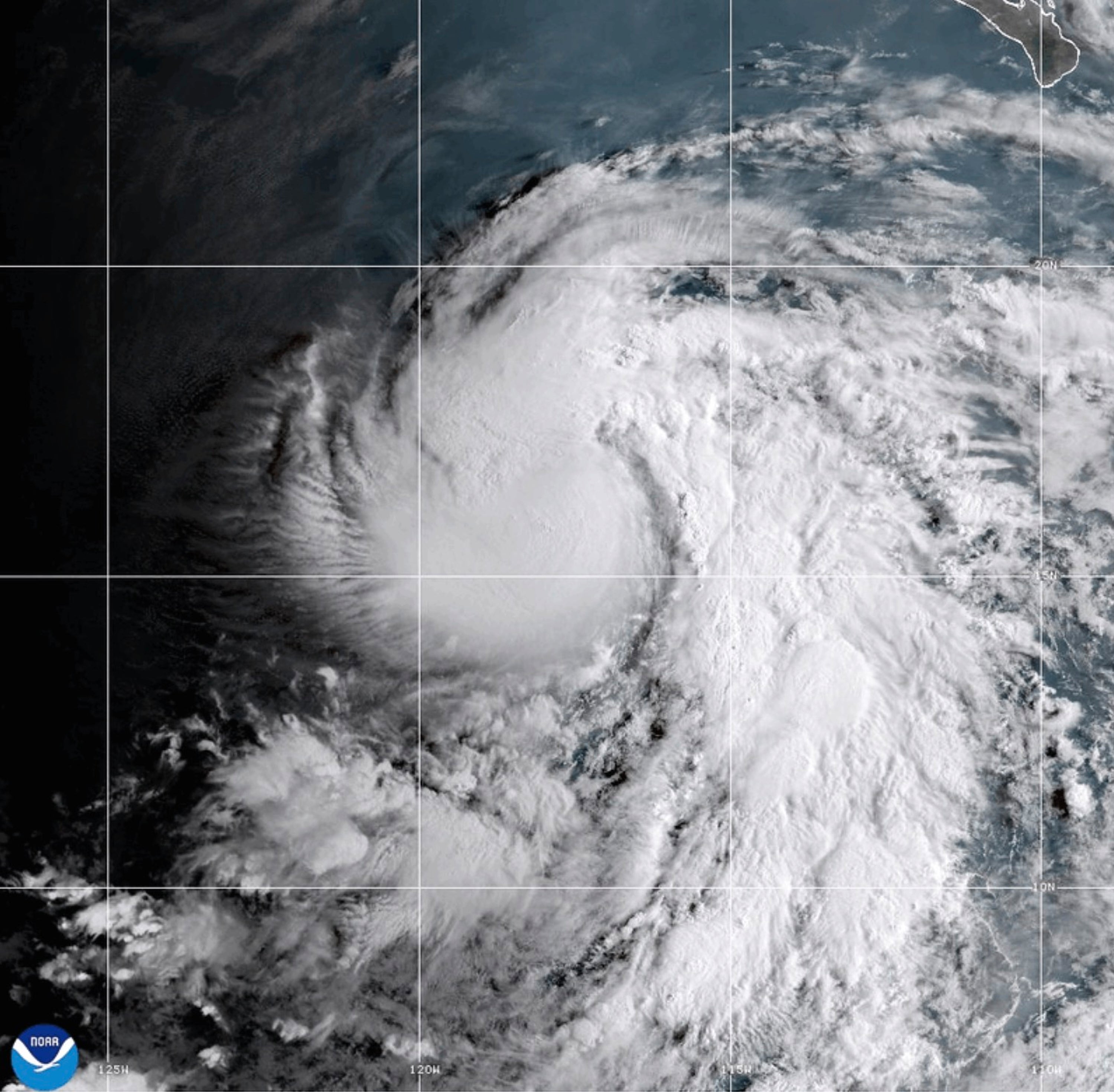 This satellite image released by NOAA shows Hurricane Karina strengthening off the southern tip of Baja California on Saturday, Aug. 29, 2026. (NOAA via AP)