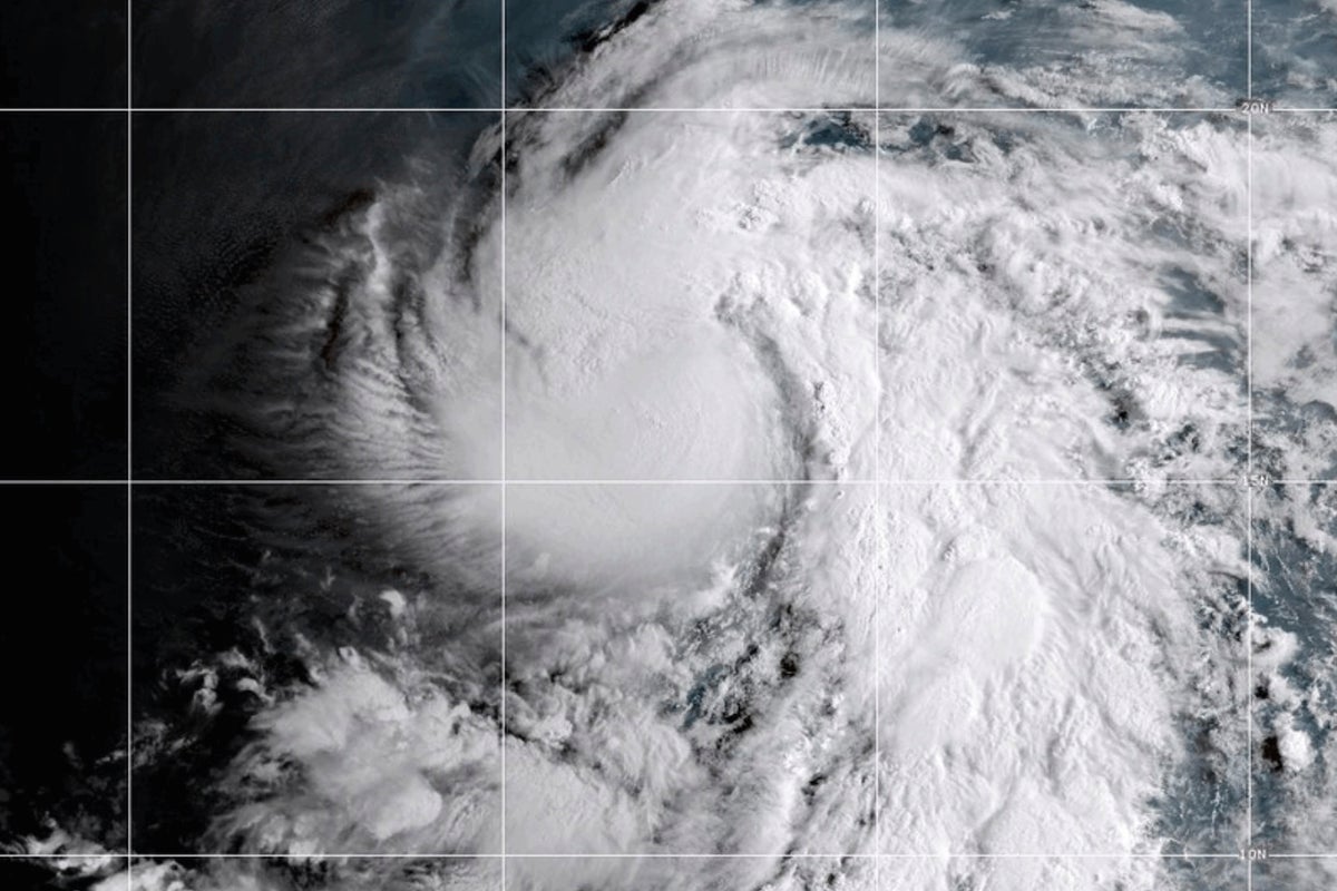 Tropical Storm Karina strengthens into a hurricane in the Pacific