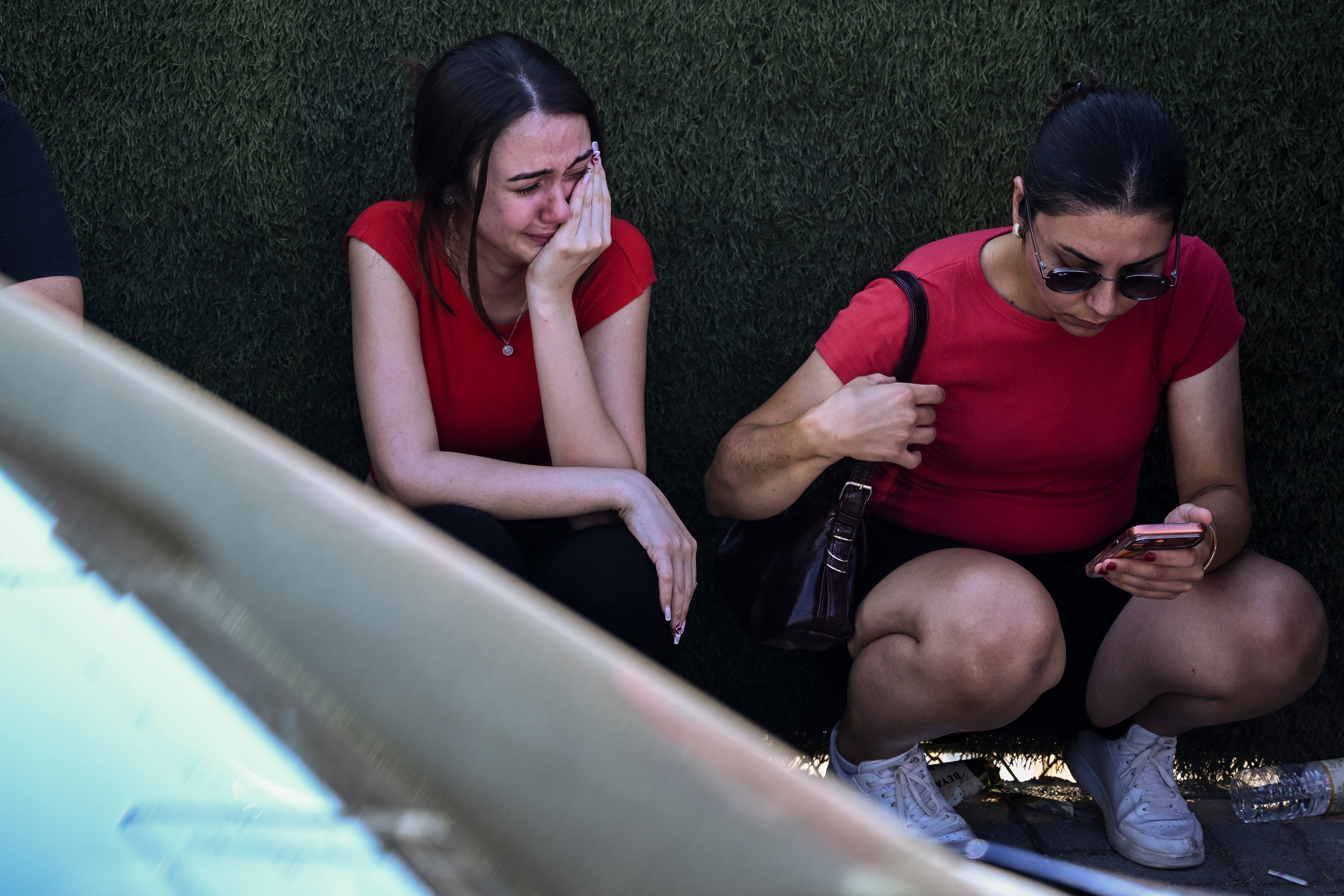 People react as they await news of their loved ones outside the port in Kyrenia, in the self-proclaimed Turkish Republic of Northern Cyprus (TRNC), recognised only by Turkey, on August 30, 2026, after a ferry capsized off the coast.