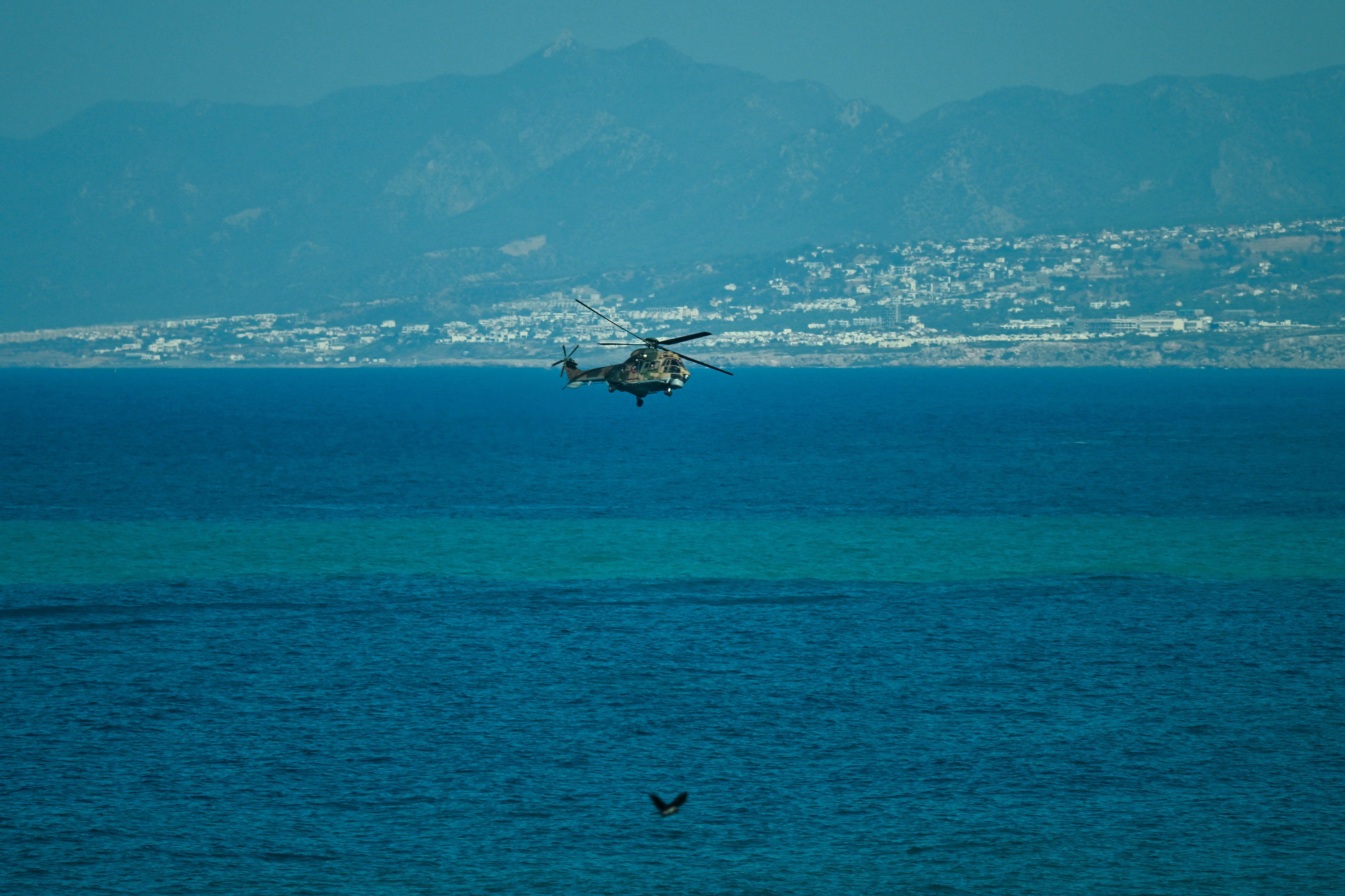 A Turkish helicopter searches the waters during a rescue operation off the coast of Kyrenia, in the self-proclaimed Turkish Republic of Northern Cyprus (TRNC), recognised only by Turkey, on August 30, 2026, after a ferry capsized. (AFP/Getty)