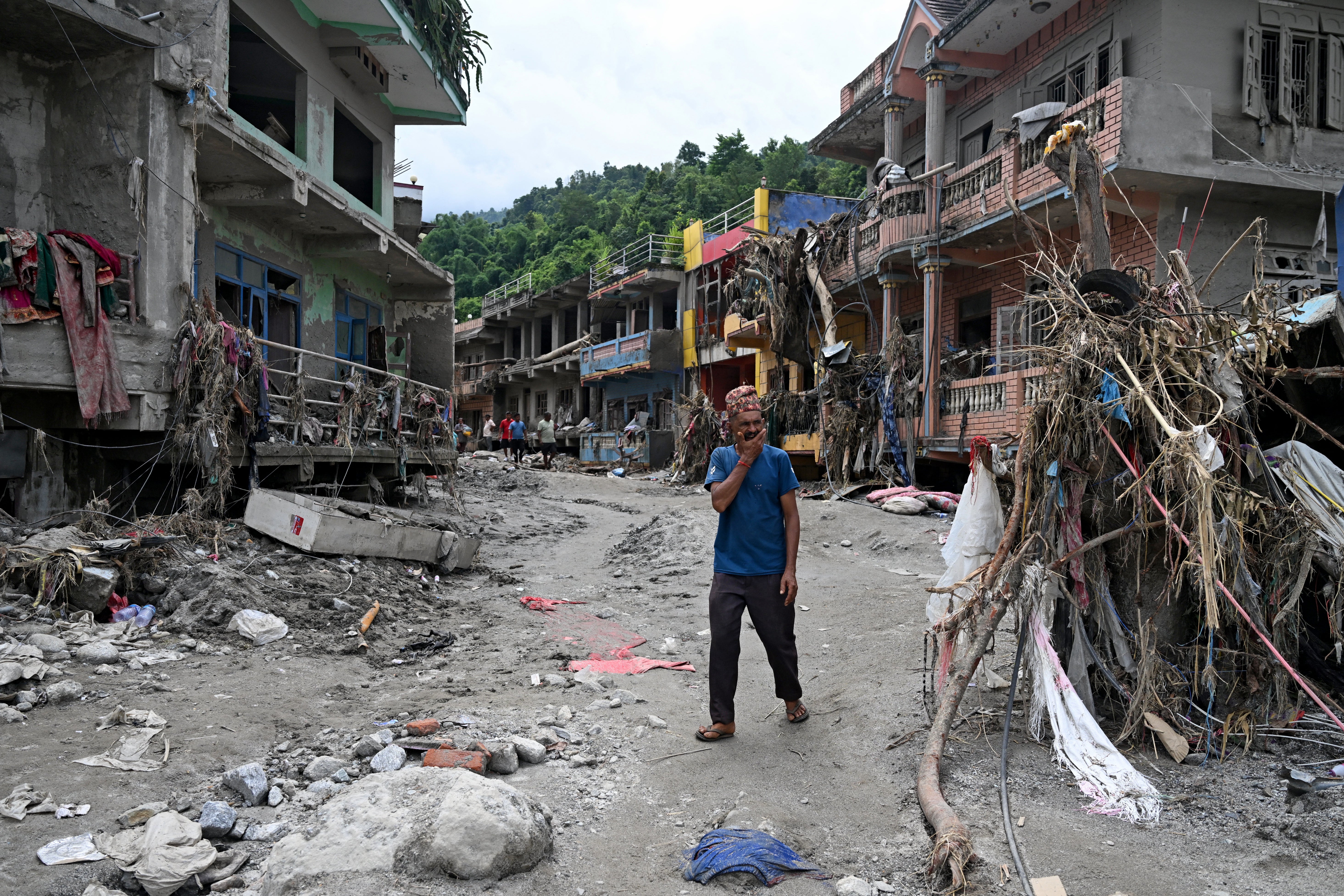 A man surveys the devastation caused by the flooding in Devighat in Nepal’s Nuwakot district