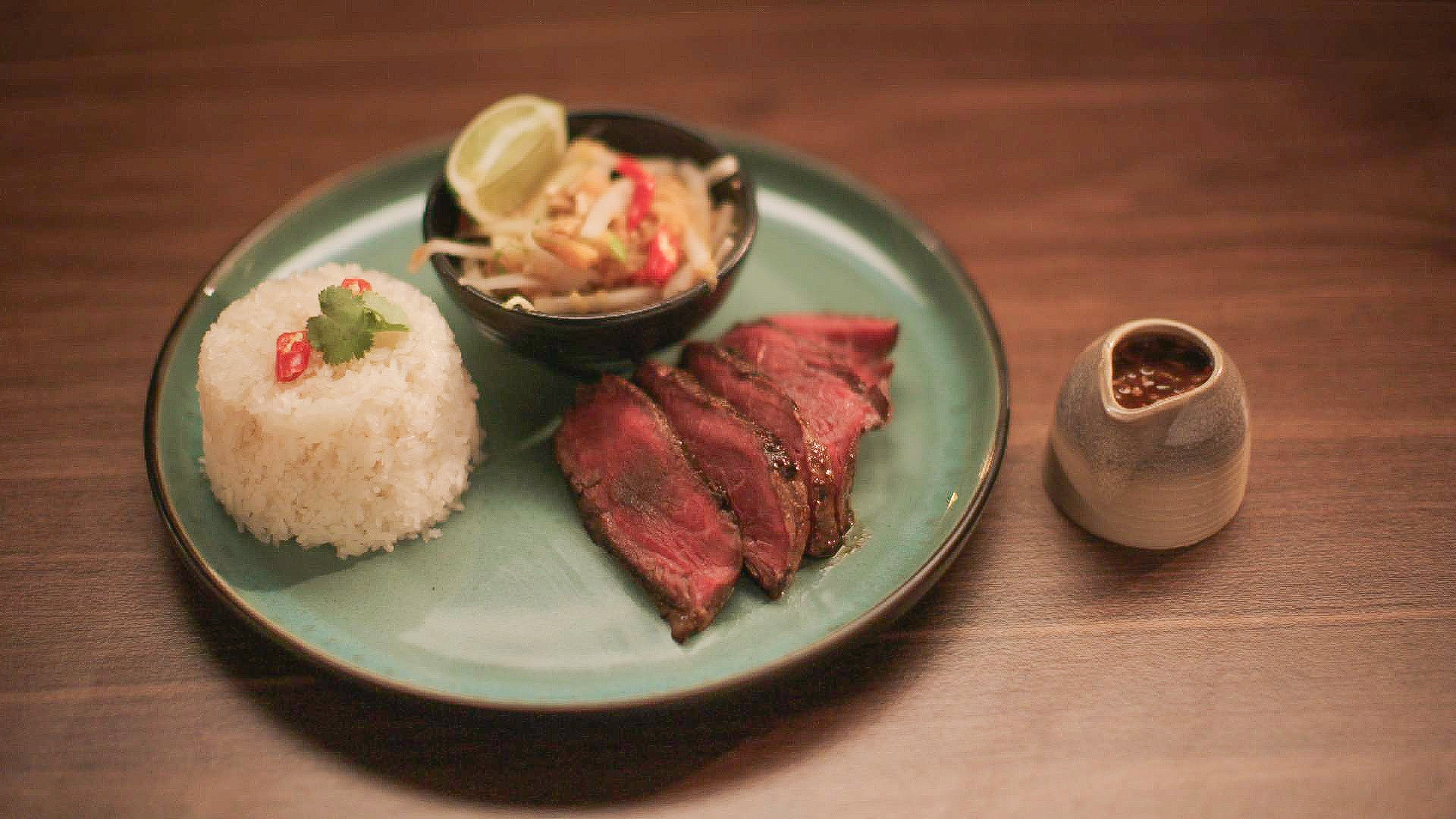 Emily Steel’s Thai marinated fillet steak comes with sticky rice, papaya salad and a seriously fiery nam jim