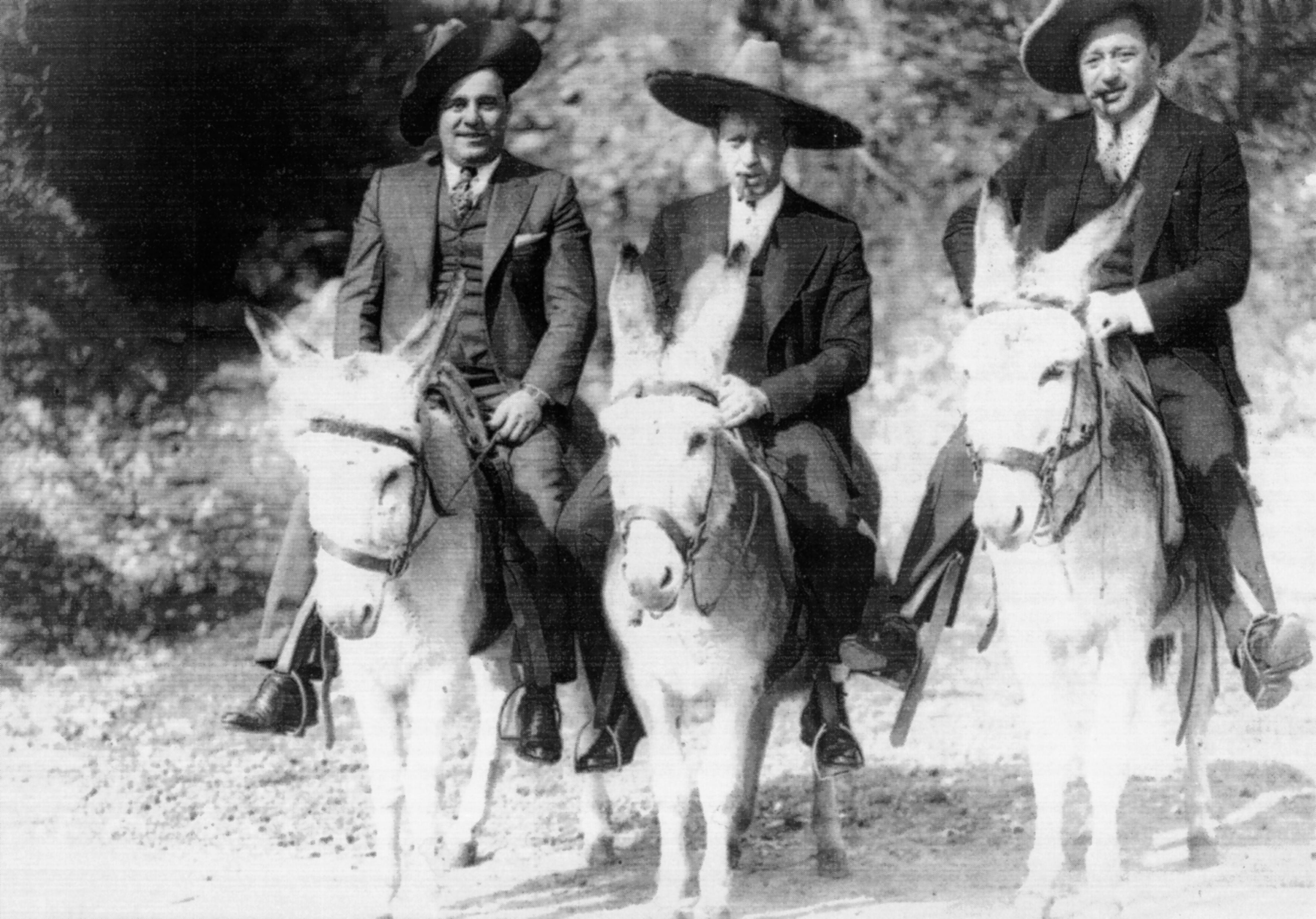 Al Capone and companions on donkeys at Happy Hollow