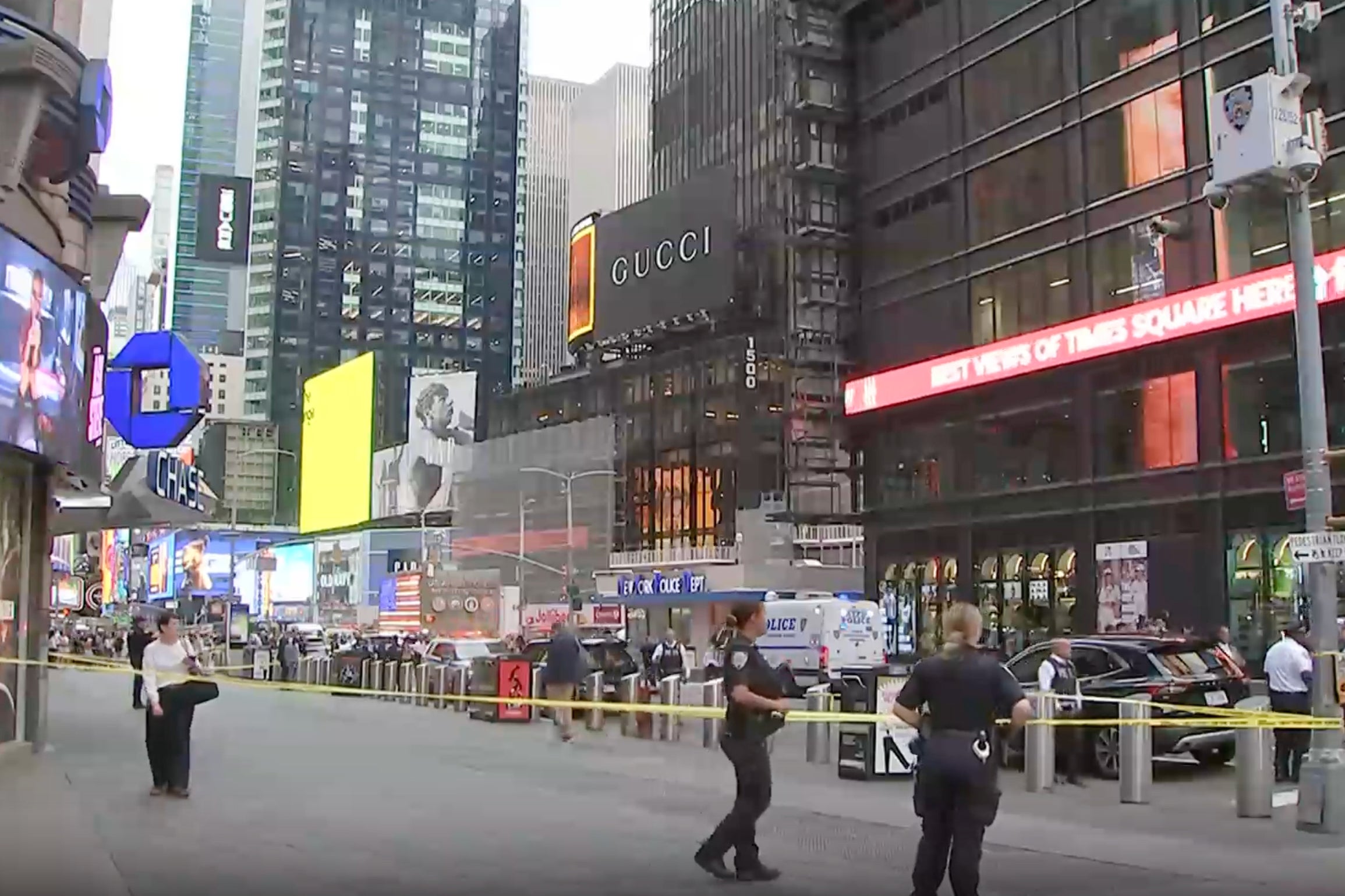 A woman has been shot dead by police in the heart of Times Square in Manhattan after she allegedly killed a person and injured another in a stabbing attack that lasted mere seconds