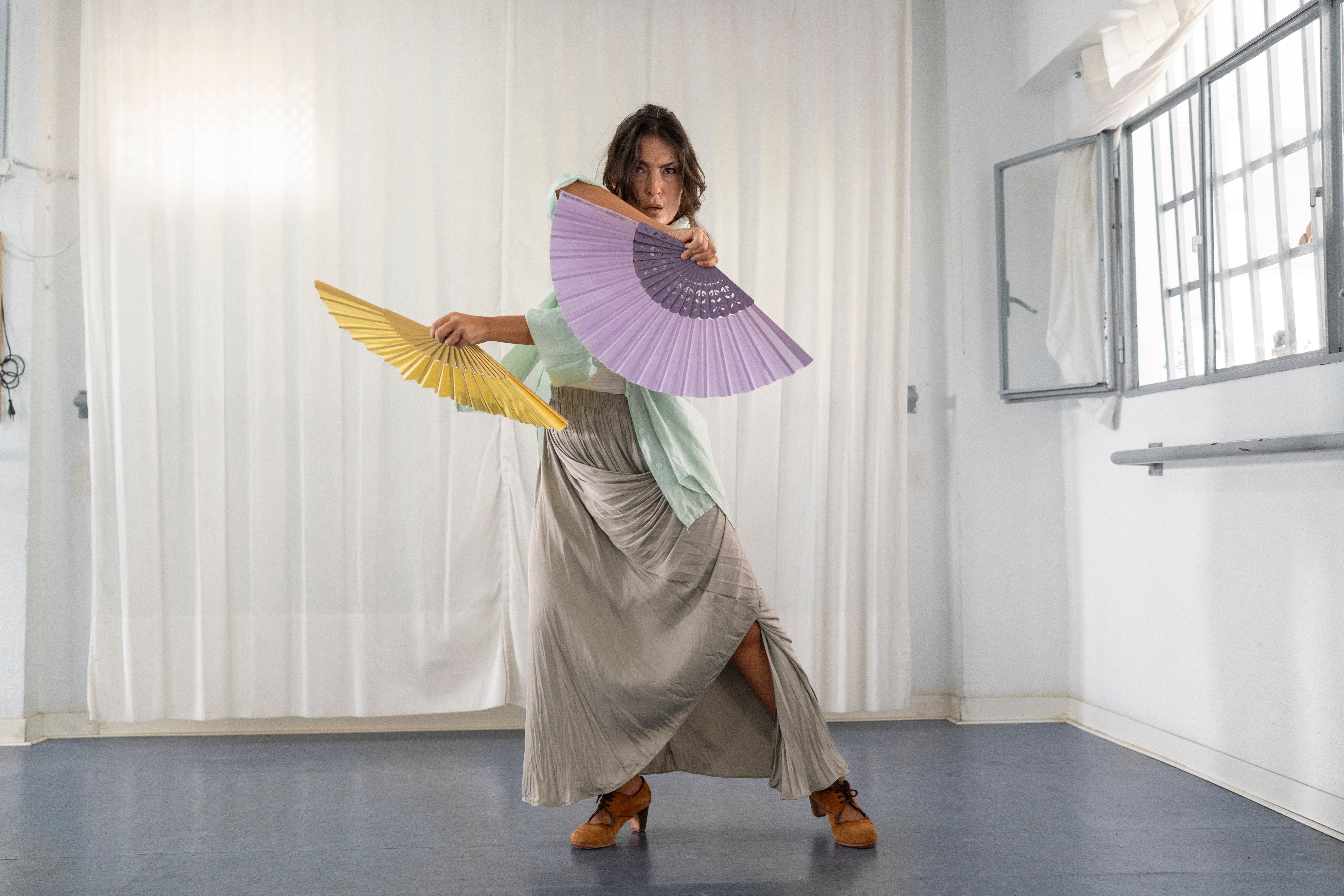 Carmen Torres, a professional flamenco dancer, rehearses a guajira, a flamenco style that traditionally incorporates the use of a fan, in Seville.
