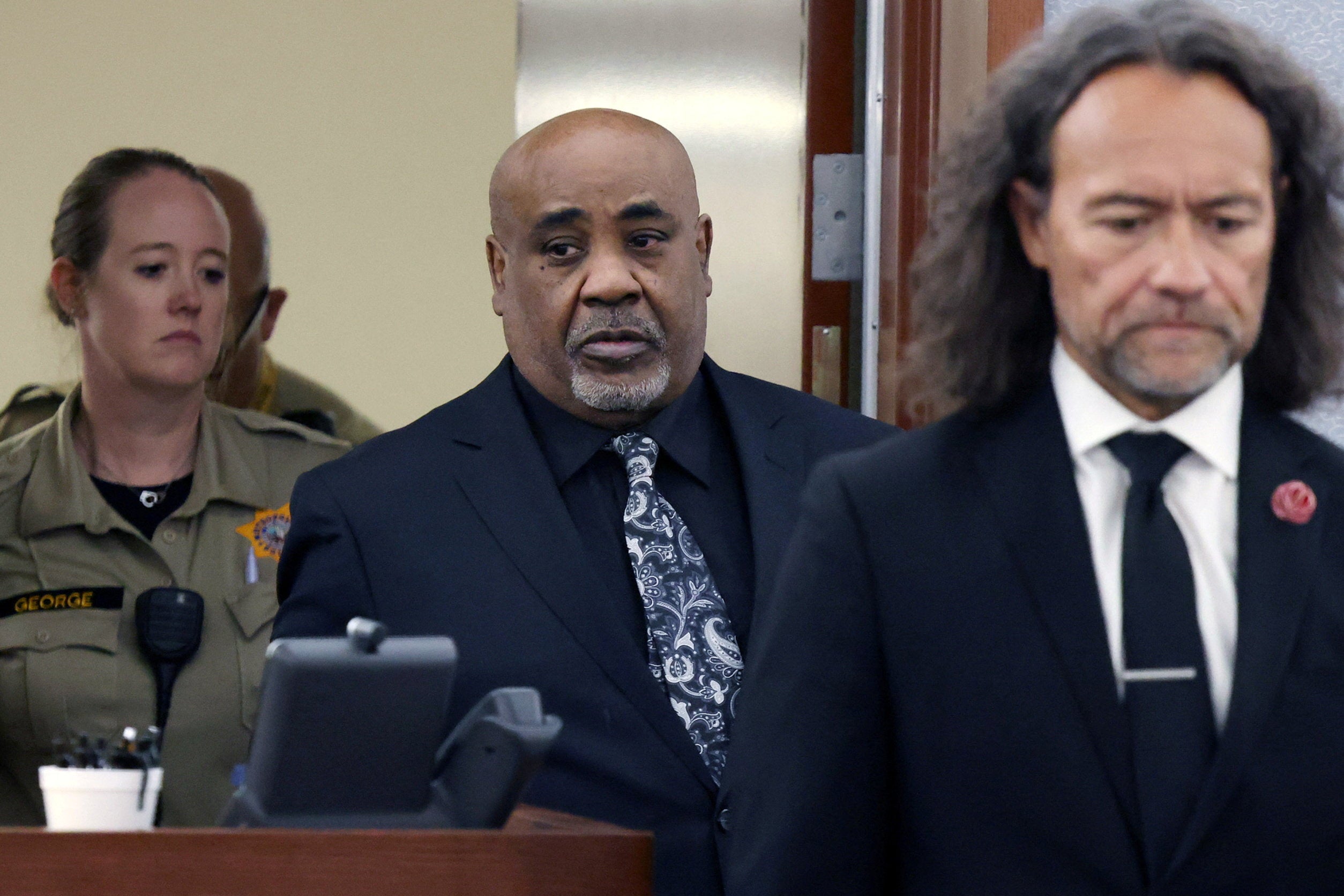 Duane Davis, center, and his attorney Michael Sanft are led back to a courtroom to hear his sentencing date after a jury found Davis guilty of first-degree murder in his trial related to the 1996 killing of rapper Tupac Shakur, at Clark County District Court Regional Justice Center, Monday, Aug. 31, 2026, in Las Vegas. Bizuayehu Tesfaye/Pool via REUTERS
