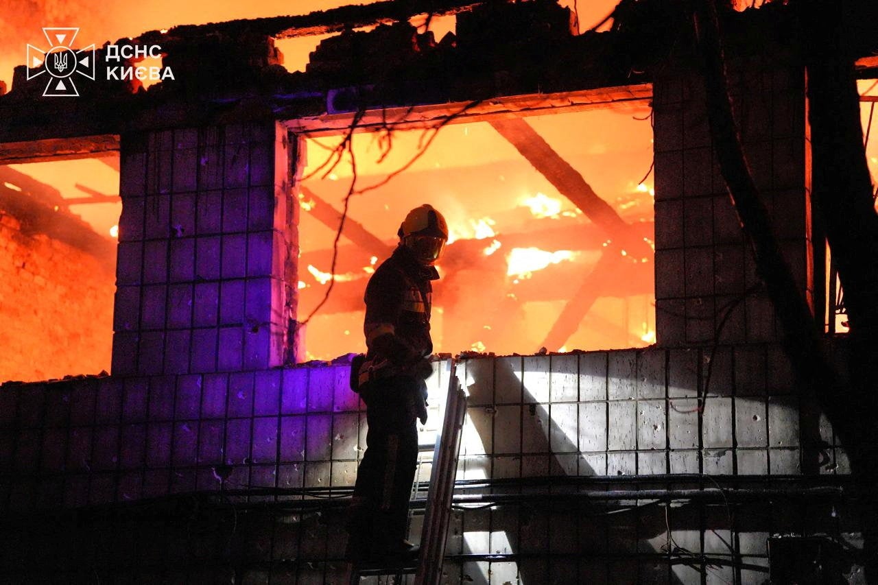 The aftermath of a Russian missile attack in Kyiv on Sunday (Reuters)