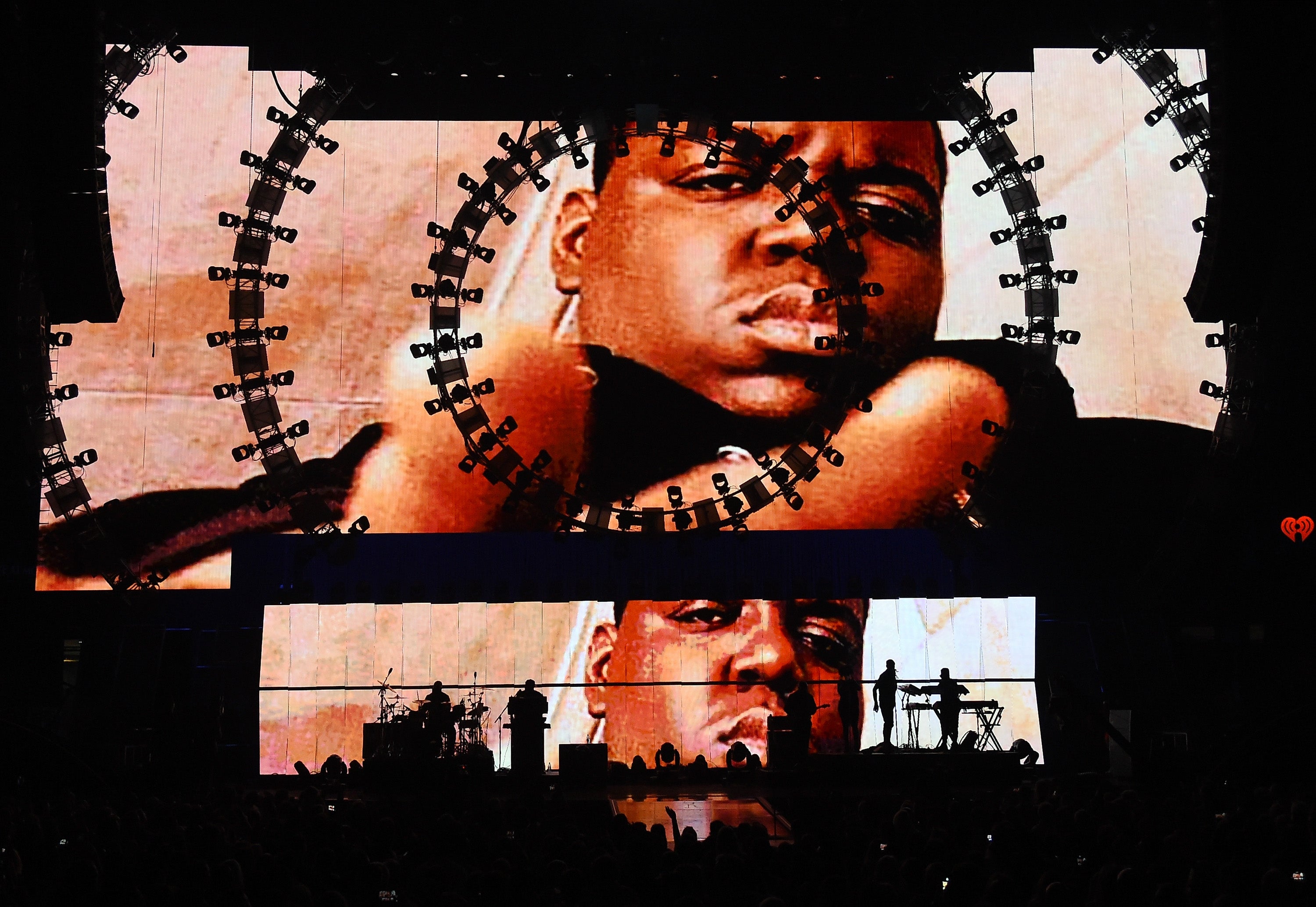 Images of the late rapper The Notorious B.I.G. are shown during a performance by recording artist Sean 